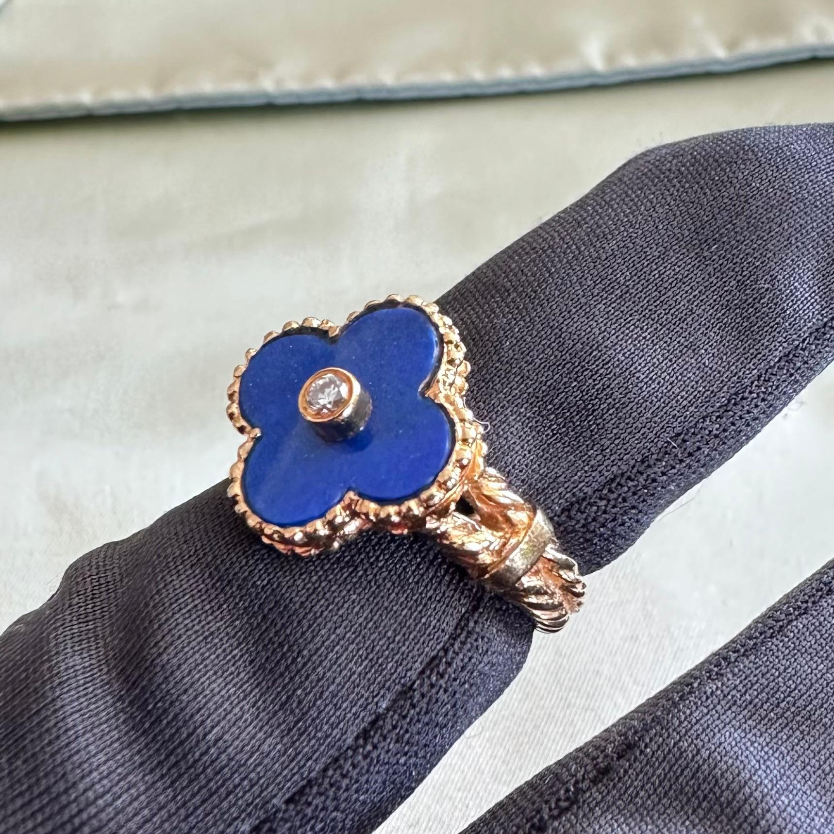 Van Cleef & Arpels Vintage Alhambra Ring
features Lapis Lazuli lucky clover Motif. 18k yellow gold and bezel-set brilliant-cut round diamond of an estimated 0.05 carats set in the center of the blue lapis lazuli petals. Made in France circa 1970s.