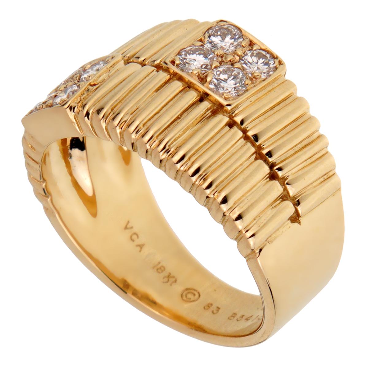 A chic Van Cleef & Arpels vintage diamond ring circa 1990s showcasing a ribbed pattern set with 8 round brilliant cut diamonds in 18k yellow gold.

Size 5 1/2