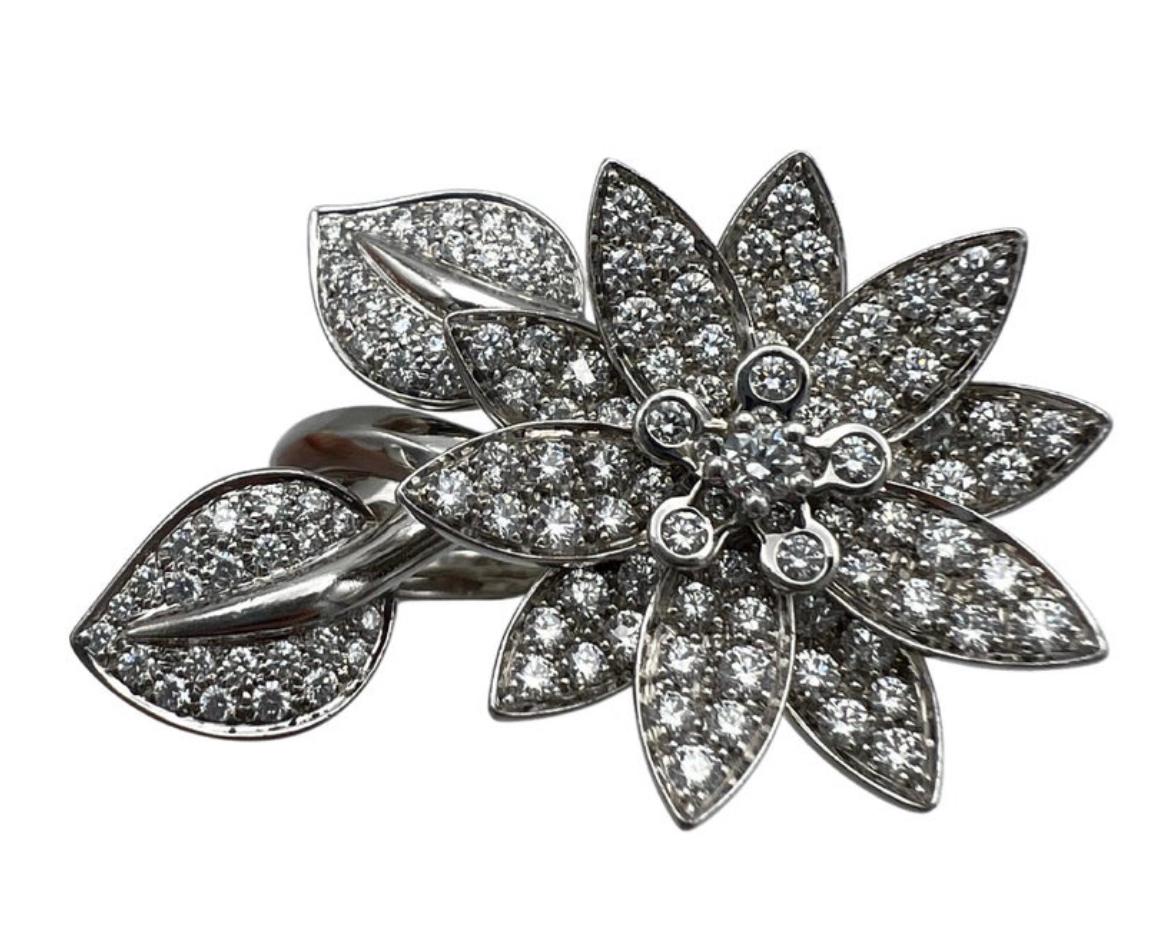 Product details:

The ring is designed by VCA, it is made out of 18 karat white gold with 2.10 carats of round brilliant cut diamonds. The ring features floral motif and between the finger style fit, meaning you can wear the ring on one finger or