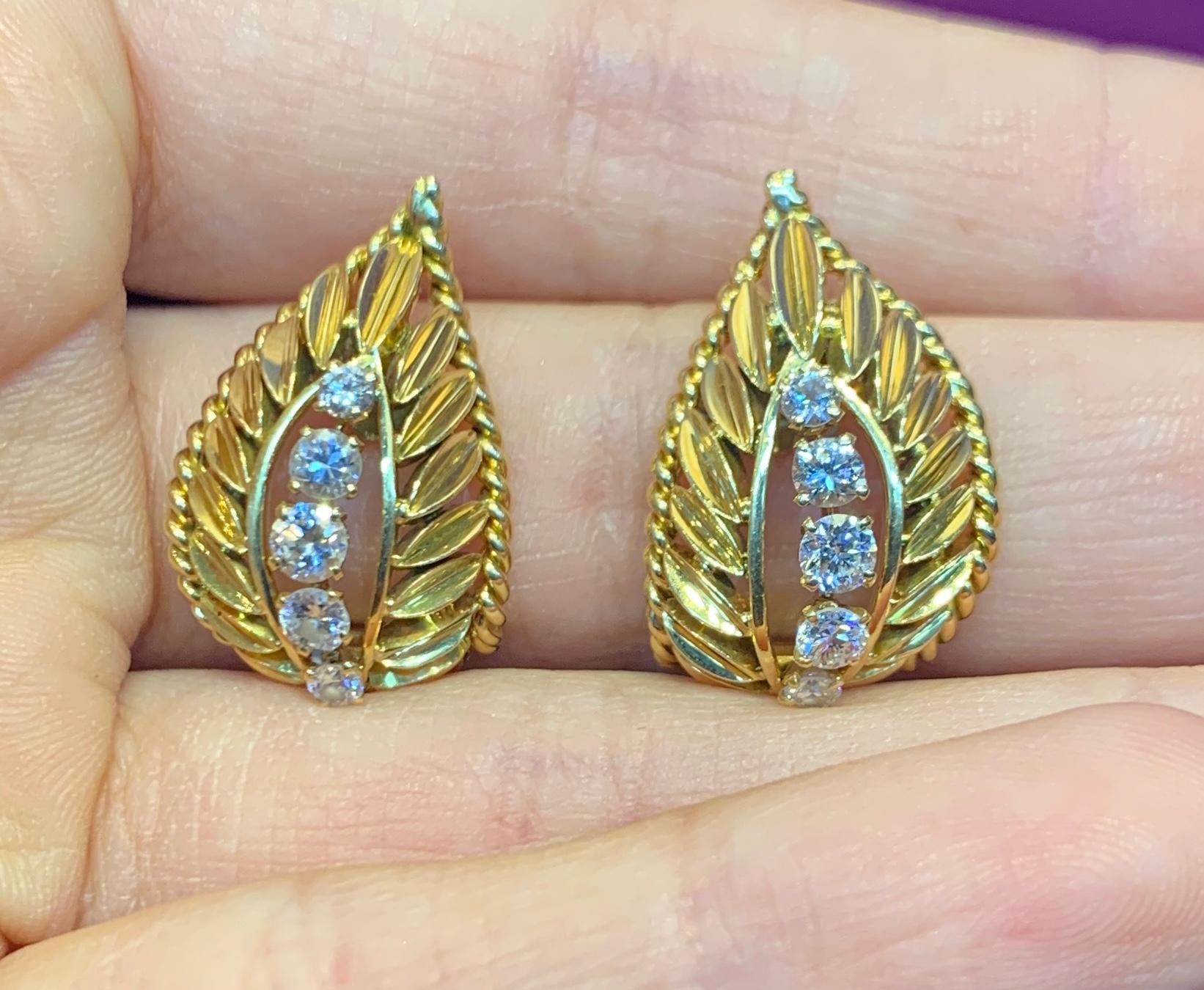 Van Cleef and Arpels Yellow Gold and Diamond Earrings

Signed Van Cleef & Arpels and Numbered

Back Type: Clip On

10 Diamonds total

.75 inches Long 

Gold Type: 18K Yellow Gold