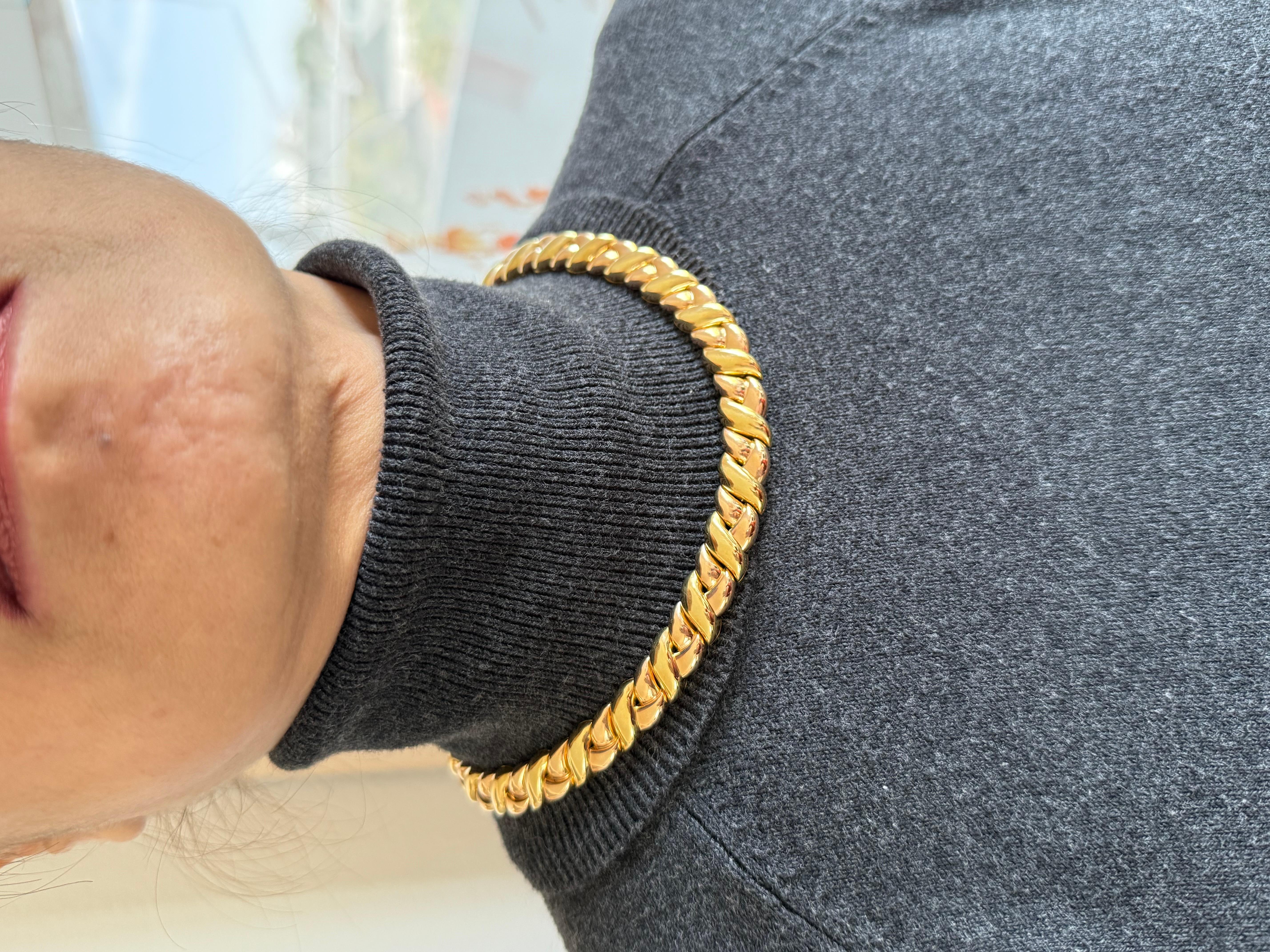 Vintage 1980s Van Cleef and Arpels yellow gold choker necklace. This variation is for a medium size neckline the necklace is 16 inches in length and 11 millimeters in with contour links of 18 karat yellow gold hallmark Van Cleef and Arpels with