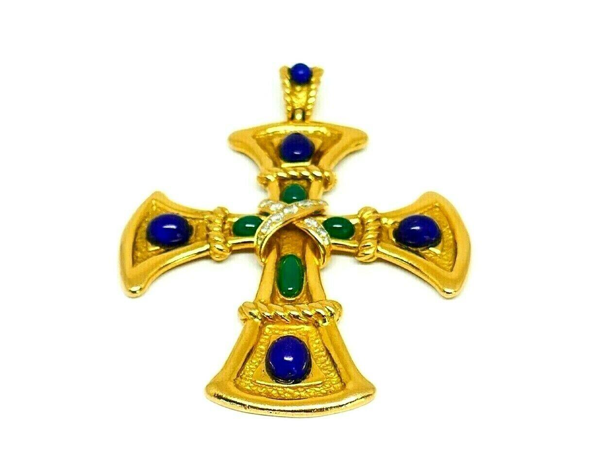 The flared cross made of 18k textured gold, tipped by 4 oval lapis stones. There are 4 oval green onyx in the center and crossed ribbons with 13 round diamonds. They are G-H color, VS clarity. 
The cross body is hammered gold with the polished gold