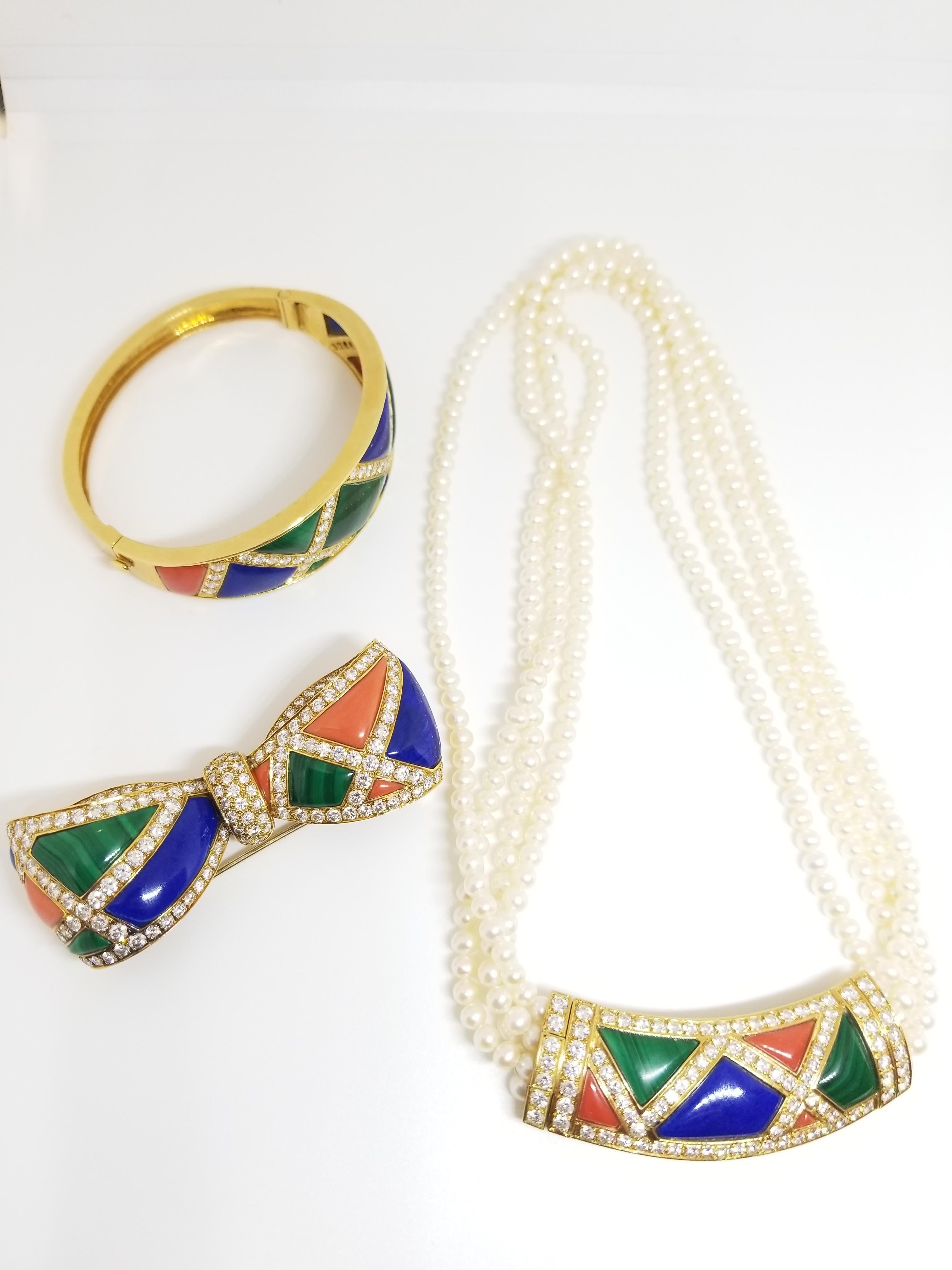 Van Cleef & Arpel Collection Set includes multi-color bracelet, multi-color brooch, and multi-color necklace.  