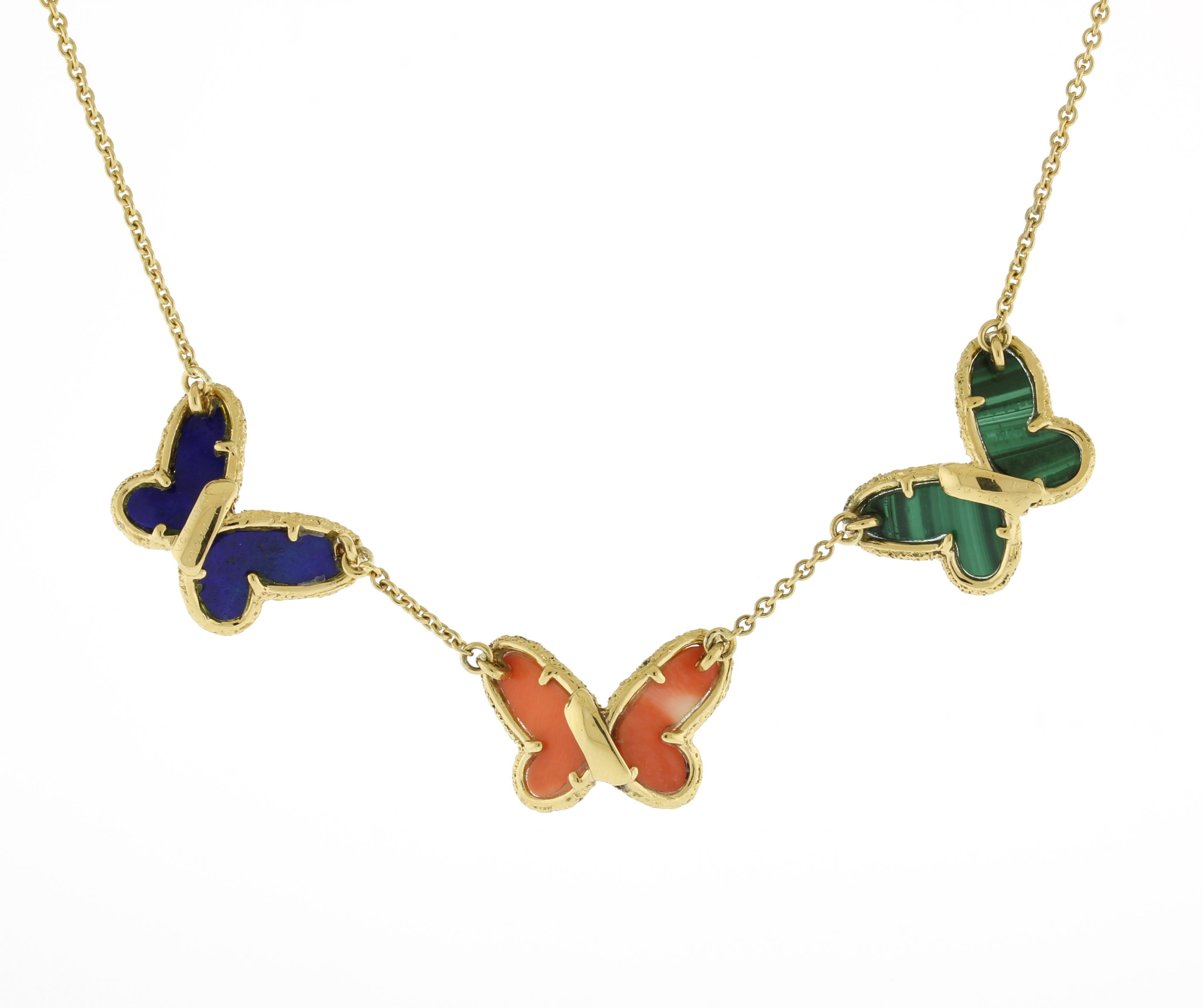 Indulge in the timeless elegance of the Butterfly Collection by Van Cleef & Arpels, where masterful craftsmanship meets nature's delicate beauty. This iconic necklace showcases three enchanting butterflies, each uniquely crafted from malachite, pink