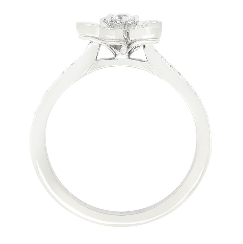 From the designer Van Cleef & Arpels comes this charming flower ring from their 'Socrate' collection. Grain set with round brilliant diamonds totalling 0.44 carat, this dainty flower design truly sparkles. The central diamond of the flower sits the