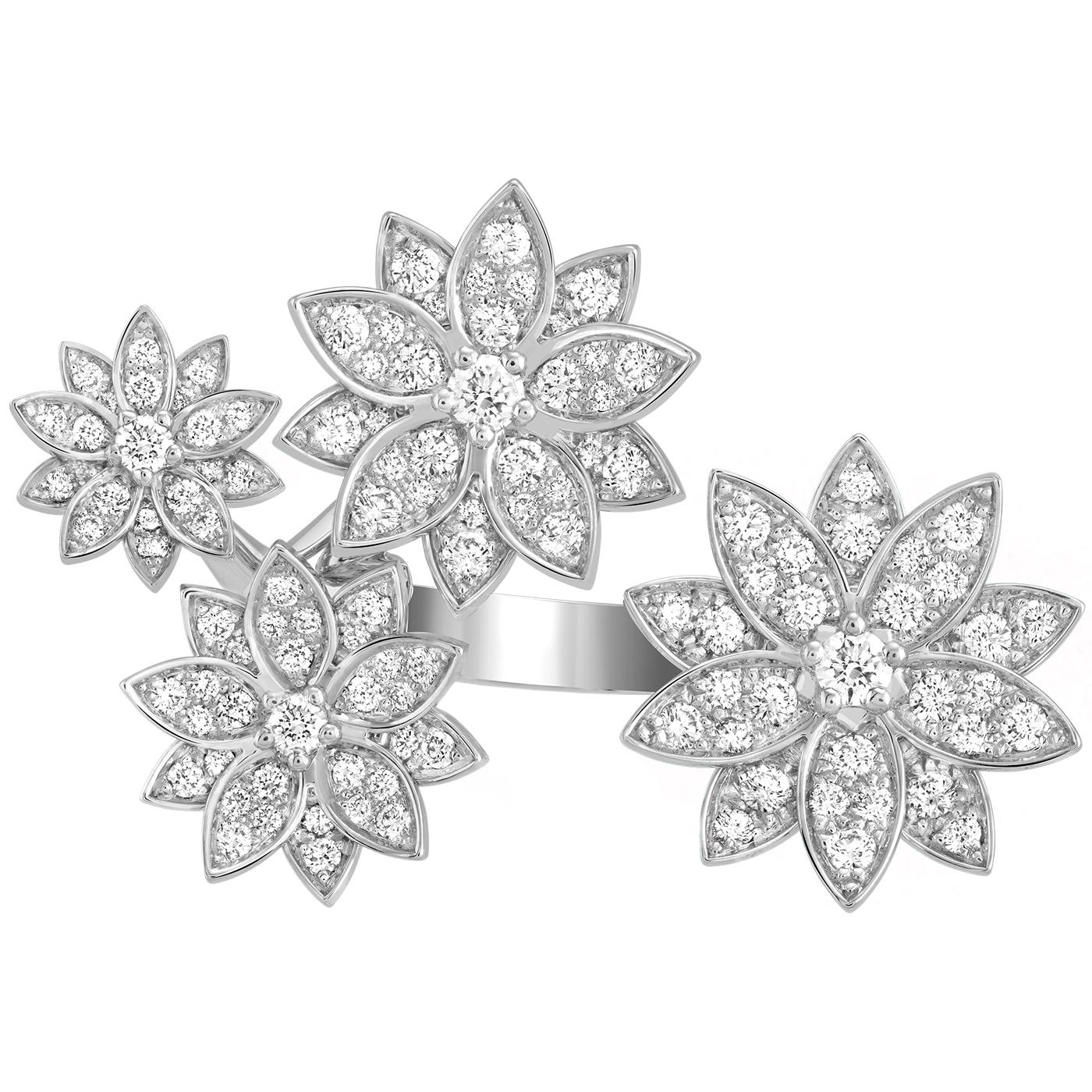 Lotus Between the Finger ring, 4 flowers, rhodium plated 18K white gold, round diamonds; diamond quality DEF, IF to VVS.

Details:
Brand: Van Cleef & Arpels
Type: Lotus Between The Finger Ring (4 Flowers)
Stones Type: Round Cut Diamonds
Carat
