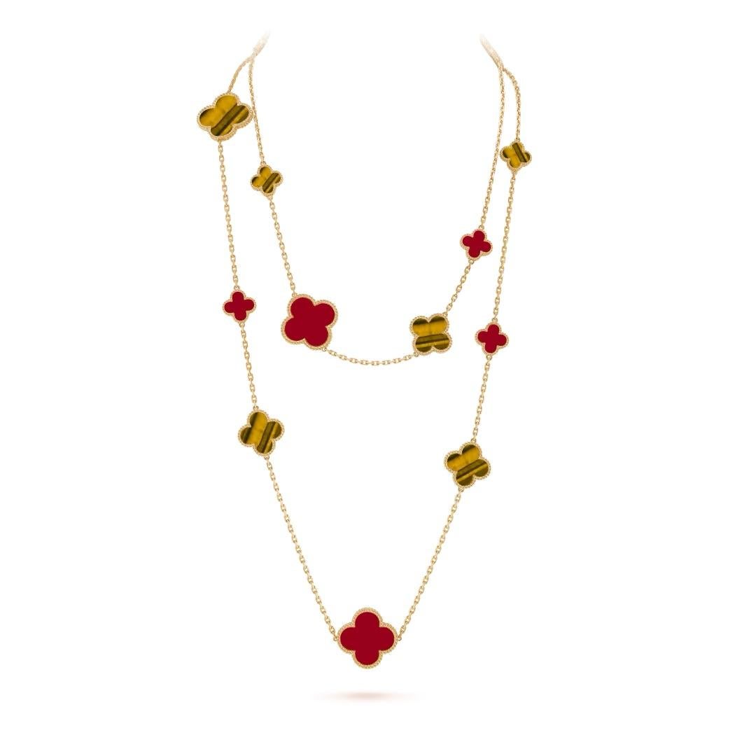 Van Cleef & Arpels 18k yellow gold necklace 16 motifs alhambra from the Magic Alhambra collection. The necklace comprises of 16 iconic 4 leaf clover motifs alternating in size, set with carnelian and tiger eye inlays and complemented by a beaded
