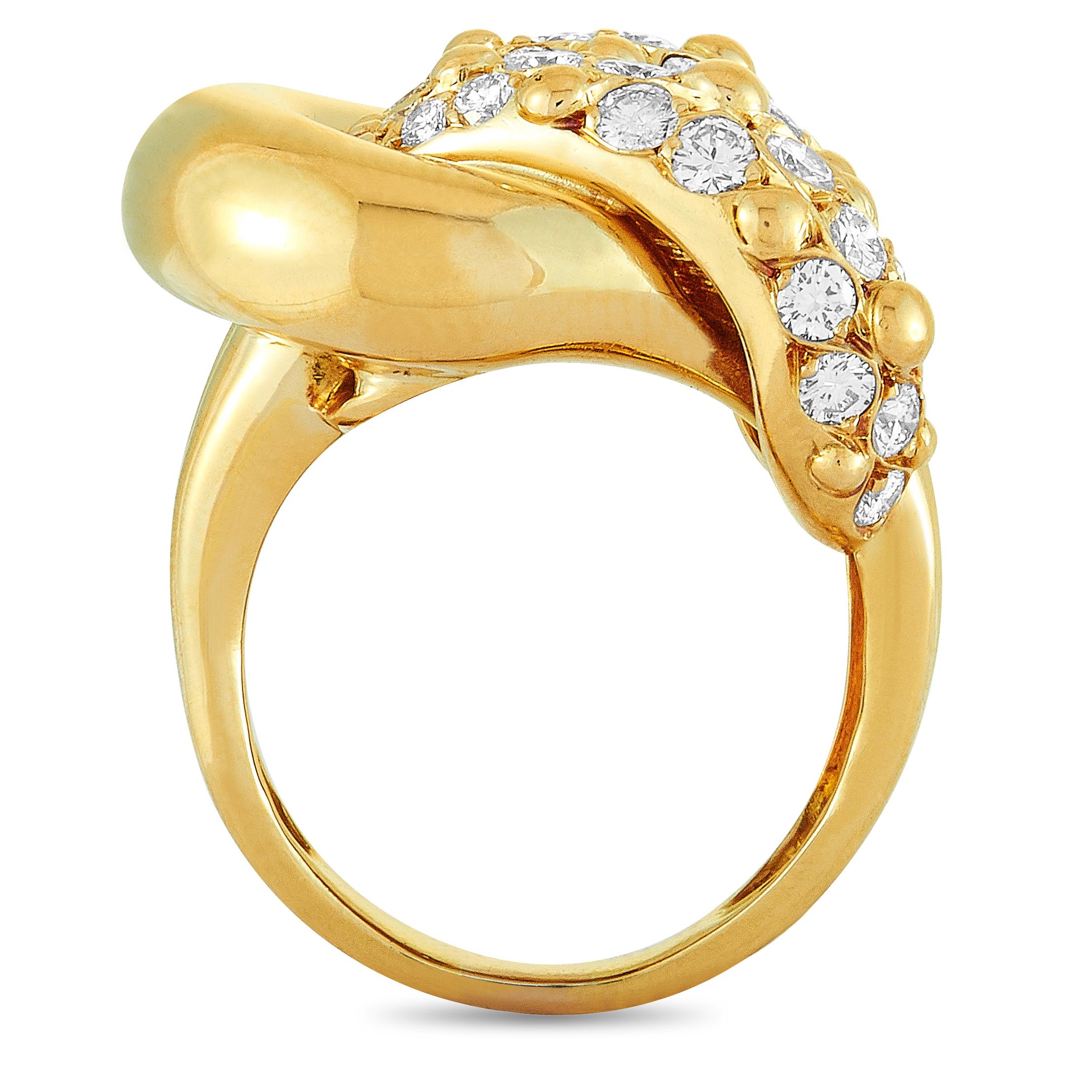 This Van Cleef & Arpels ring is made out of 18K yellow gold and diamonds that total 1.70 carats and feature grade F color and VVS clarity. The ring weighs 14.4 grams, boasting band thickness of 3 mm and top height of 8 mm, while top dimensions