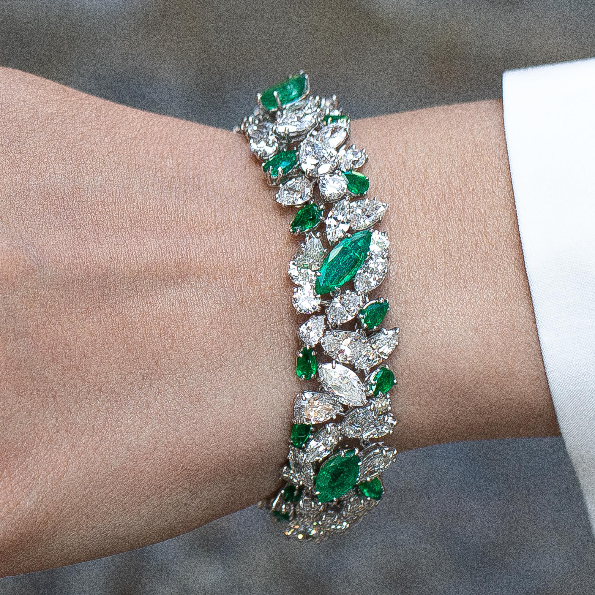 Signed Van Cleef & Arpels bracelet featuring 18 Carats Fine Emeralds. Exquisitely crafted Marquise and pear shaped emeralds and diamonds, adorn your wrist with beauty and elegance. 
Fine Emeralds = 18 carats
Diamonds = 30 carats
( Color: D-E,