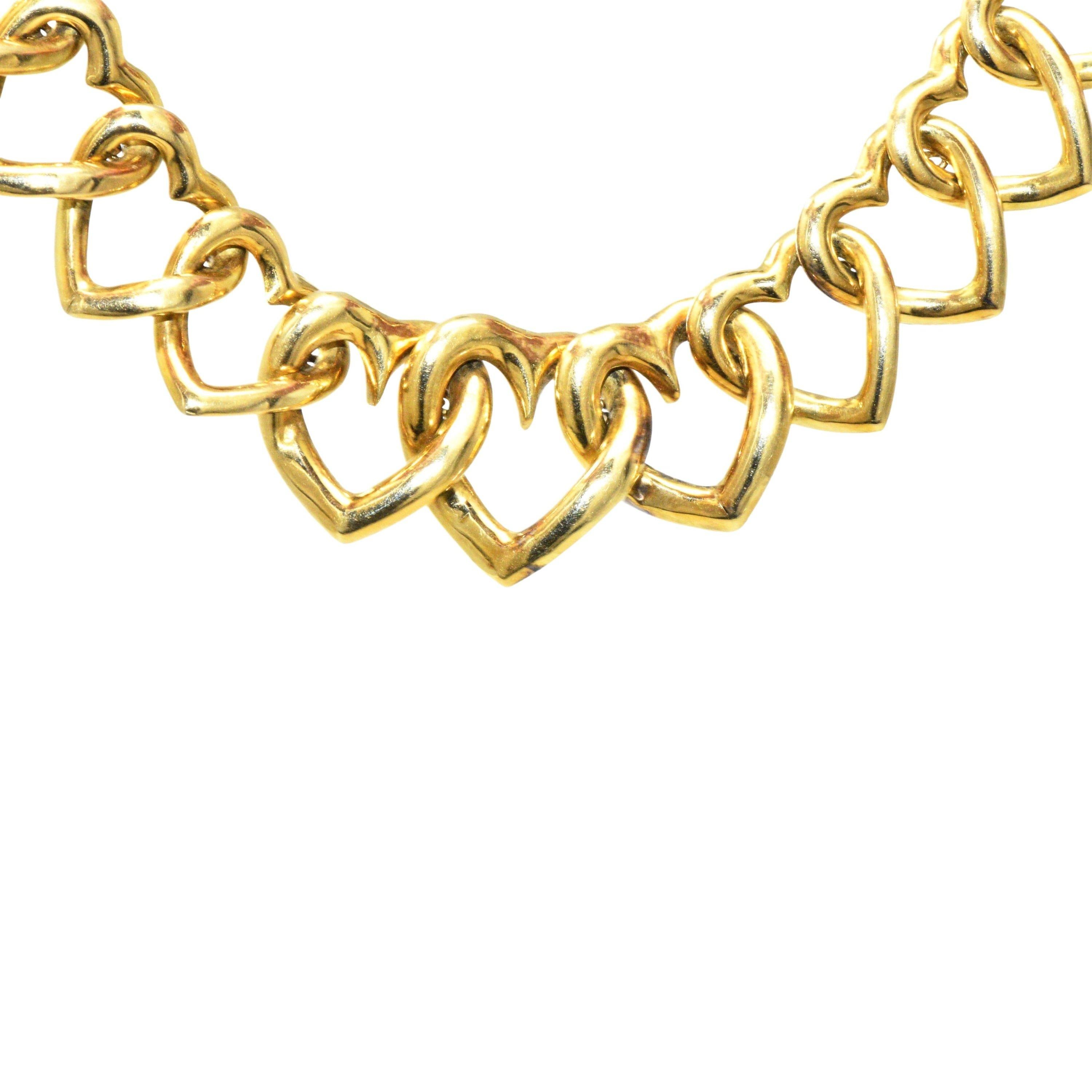 Link style necklace comprised of polished gold open hearts; graduating in size

Completed by concealed clasp with figure eight safety

Signed VCA NY 4V40-2 

Stamped Italy 18KT for 18 karat Italian gold

Length: 17 1/2 inches 

Width: tapers from