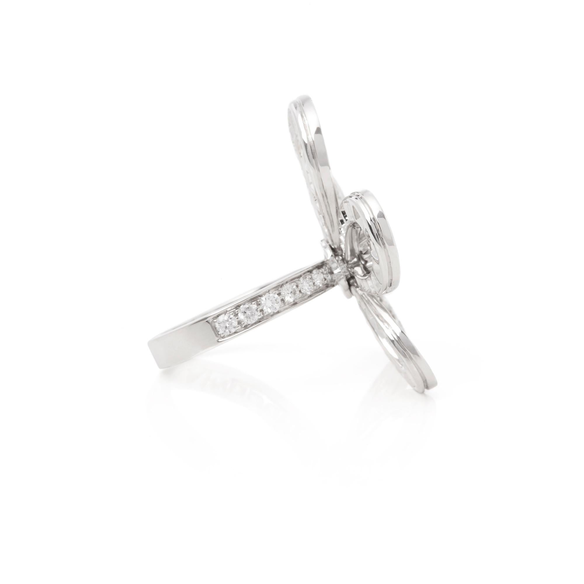 Modern Van Cleef & Arpels 18 Karat White Gold Round Cut Diamond Flowerlace Ring