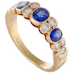 Van Cleef 
Arpels 18 Karat Yellow Gold Diamond and 3-Sapphire Band Ring