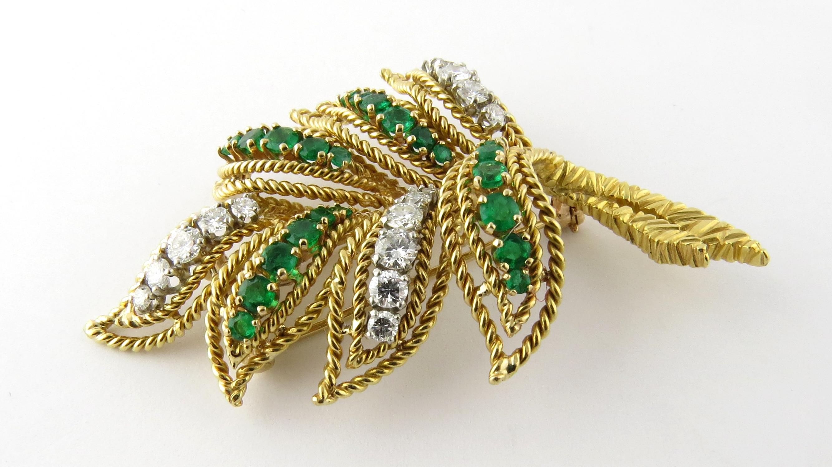 Van Cleef & Arpels 18K Yellow Gold Diamond Emerald Leaf Brooch Pin 

This gorgeous vintage brooch dates back to the 1960's.

It is created with braided leaves of gold set with genuine green emeralds and diamonds.

16 round brilliant diamonds graded