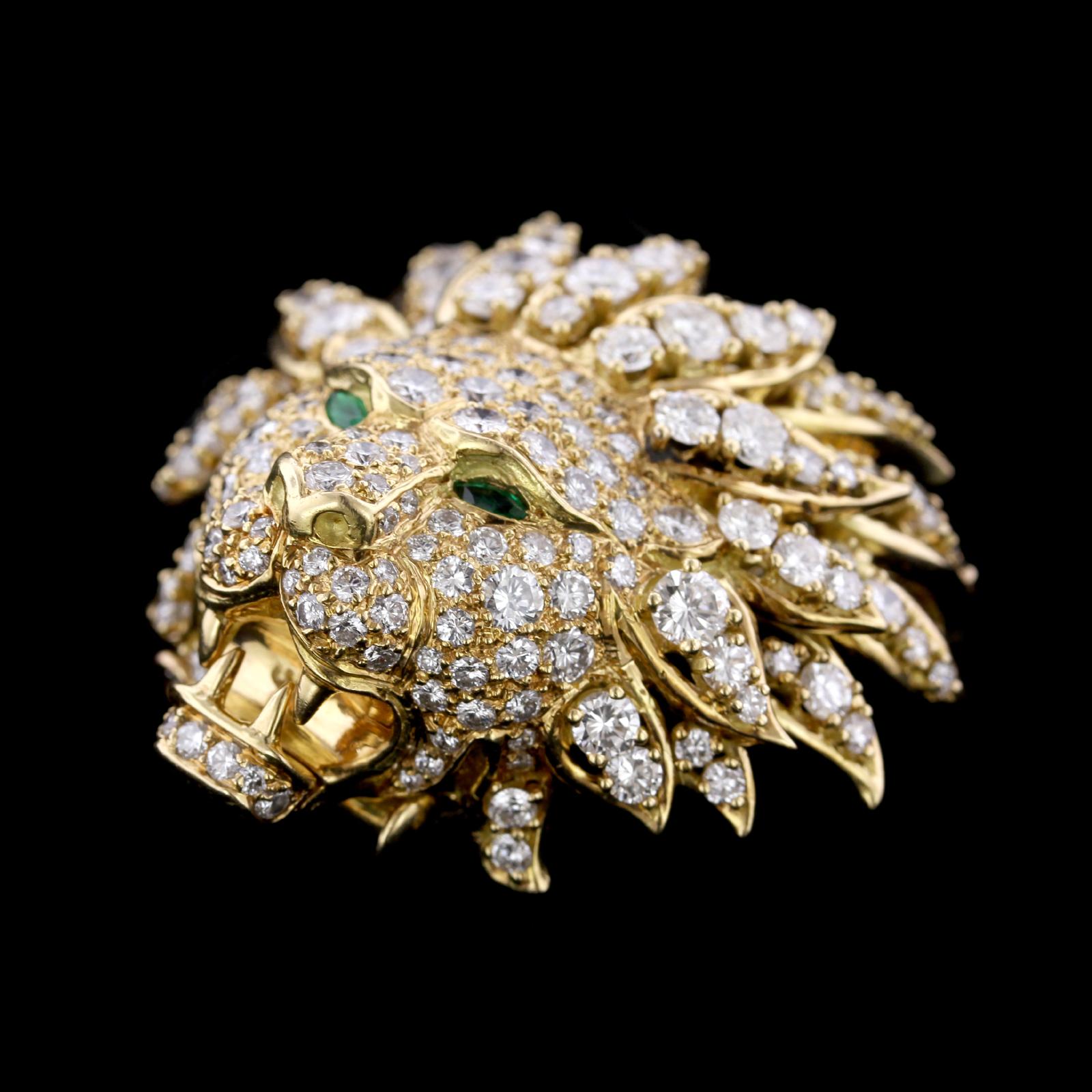 Van Cleef & Arpels 18K Yellow Gold Diamond Lion Brooch. The brooch is set with 164 round brilliant cut diamonds, approximate total wt. 6.00cts., G color, VS clarity, with two marquise cut emerald eyes, NY, numbered, length 1 3/4