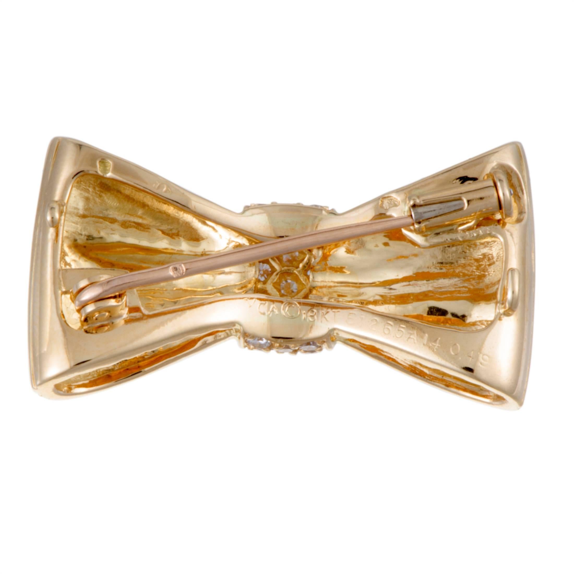 Taking the attractive form of an ever-feminine bow, this beautiful Van Cleef & Arpels brooch will accentuate your style in the most charming manner. Splendidly crafted from radiant 18K yellow gold, the brooch is luxuriously embellished with