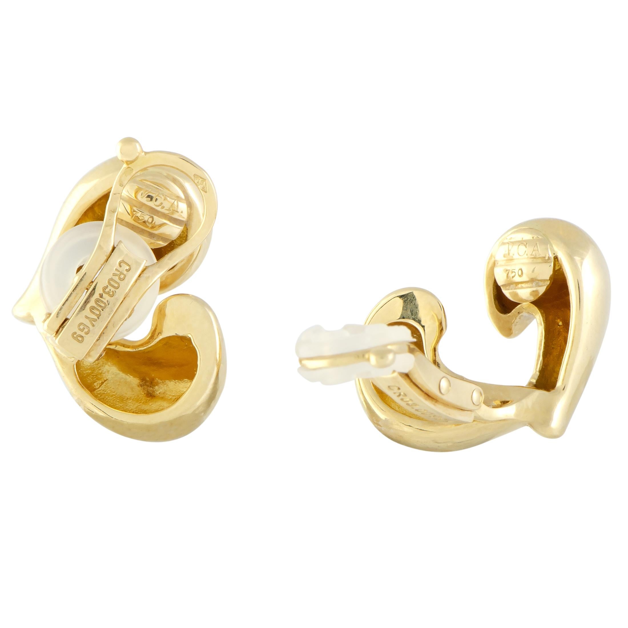 Crafted entirely from gracefully shaped and flawlessly polished 18K yellow gold that lends its fabulously luxurious sheen to the slightly unconventional design, these marvelous vintage earrings from Van Cleef & Arpels boast the adorable heart motif
