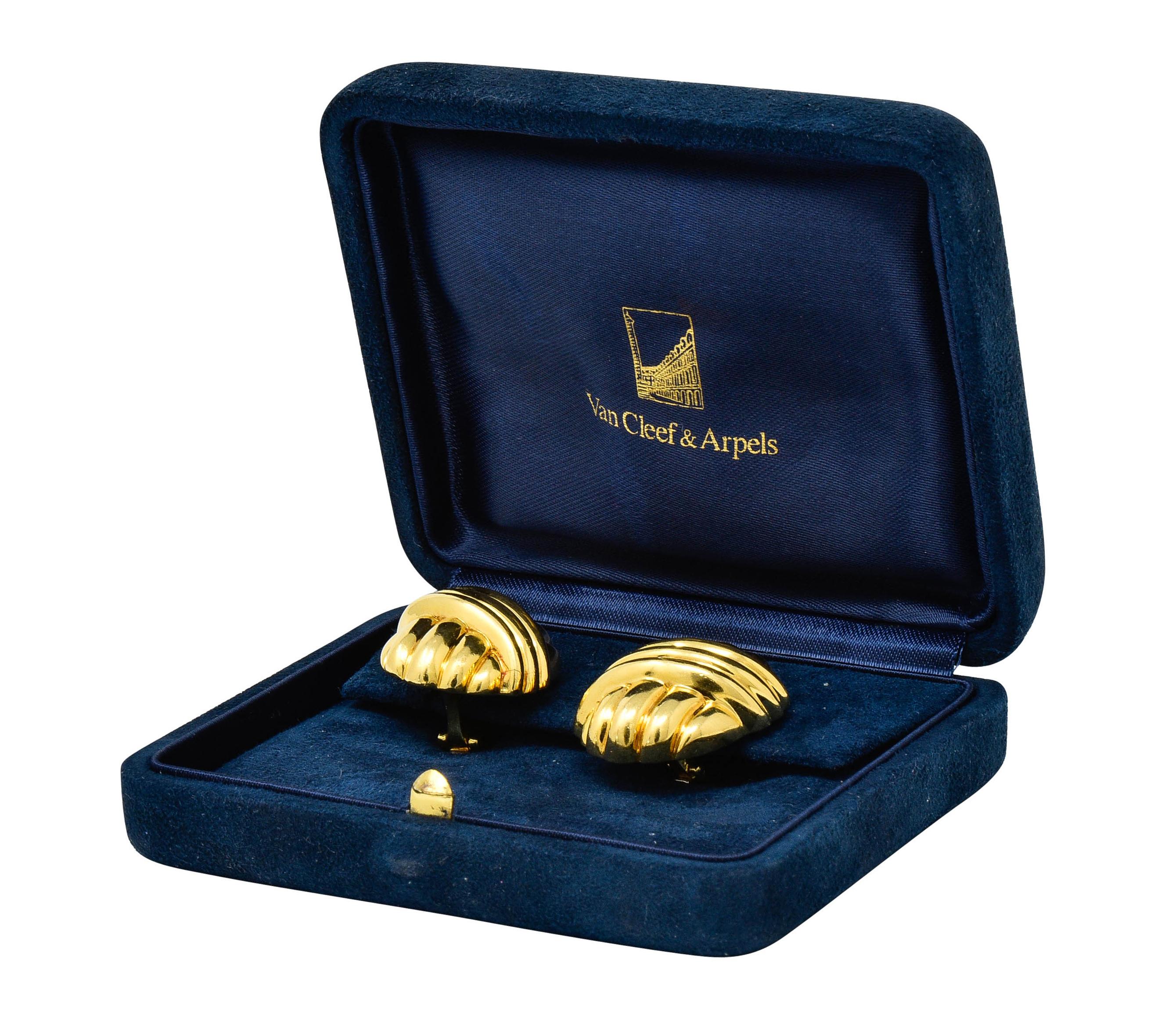 Substantially sized ear-clip earrings designed as a knot motif with deeply ridged gold

With a bright finish

Completed by hinged omega backs

Numbered and signed VCA New York

Stamped 18K for 18 karat gold

Circa: 1970s

Measures: 7/8 x 1 1/8