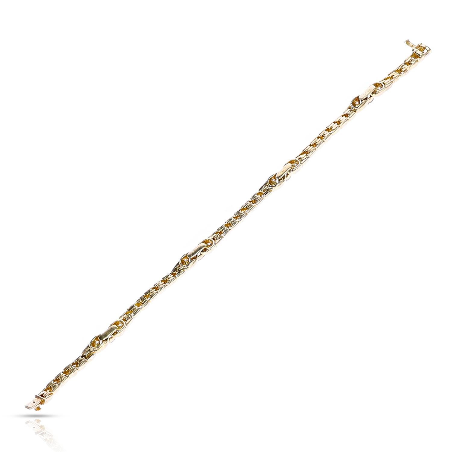 A Van Cleef & Arpels 1.83 ct. Rounds and 1.20 ct. Marquise Diamond Bracelet made in 18 Karat Yellow Gold. There are 89 round diamonds and 4 marquise diamonds. The bracelet is 6.90 inches and the total weight is 15.10 grams. 