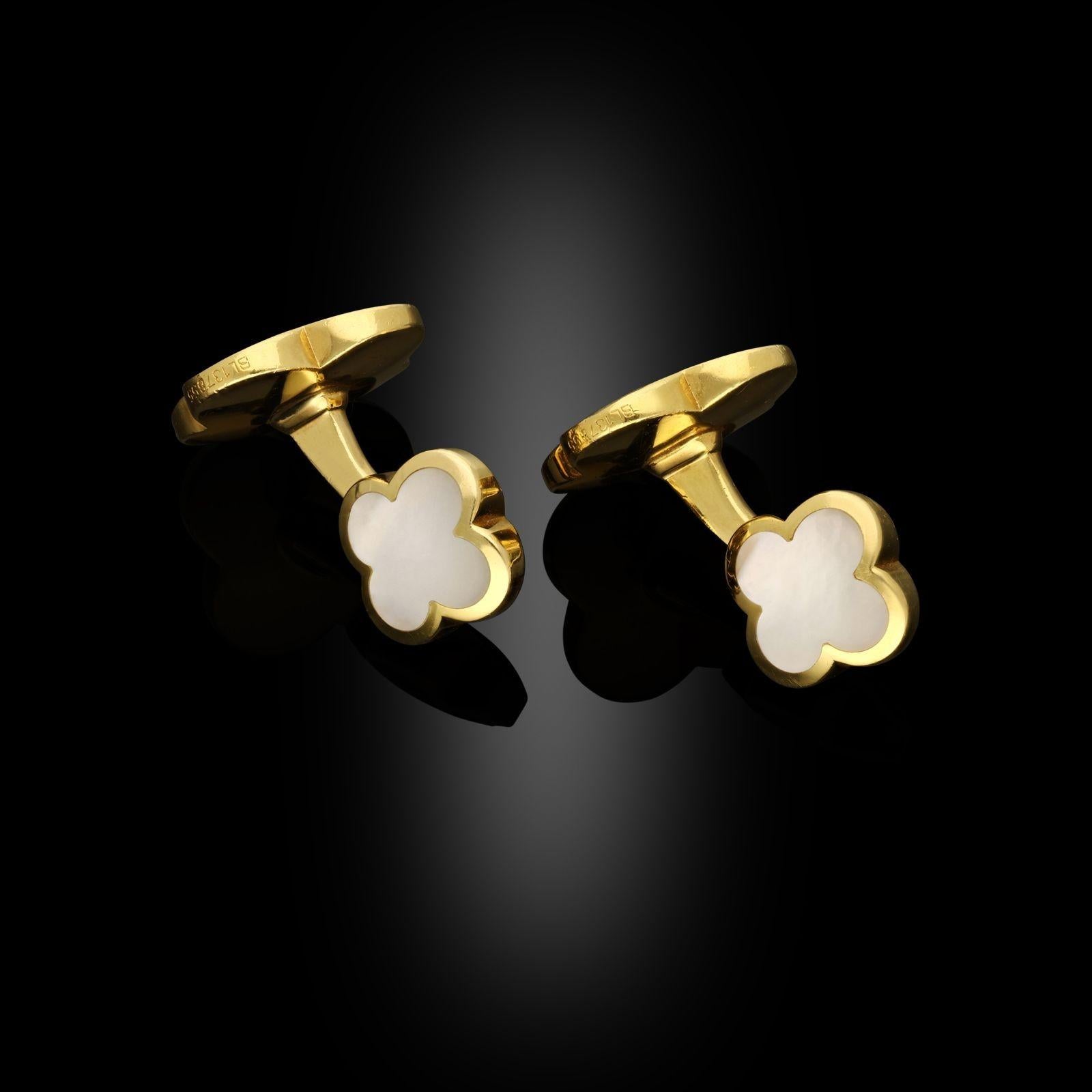 A chic pair of 18ct gold and mother of pearl ‘Alhambra’ cufflinks by Van Cleef & Arpels c.2010, the double ended cufflinks with one large and one smaller head, both formed of the iconic Alhambra quatrefoil clover motif in carved and polished mother