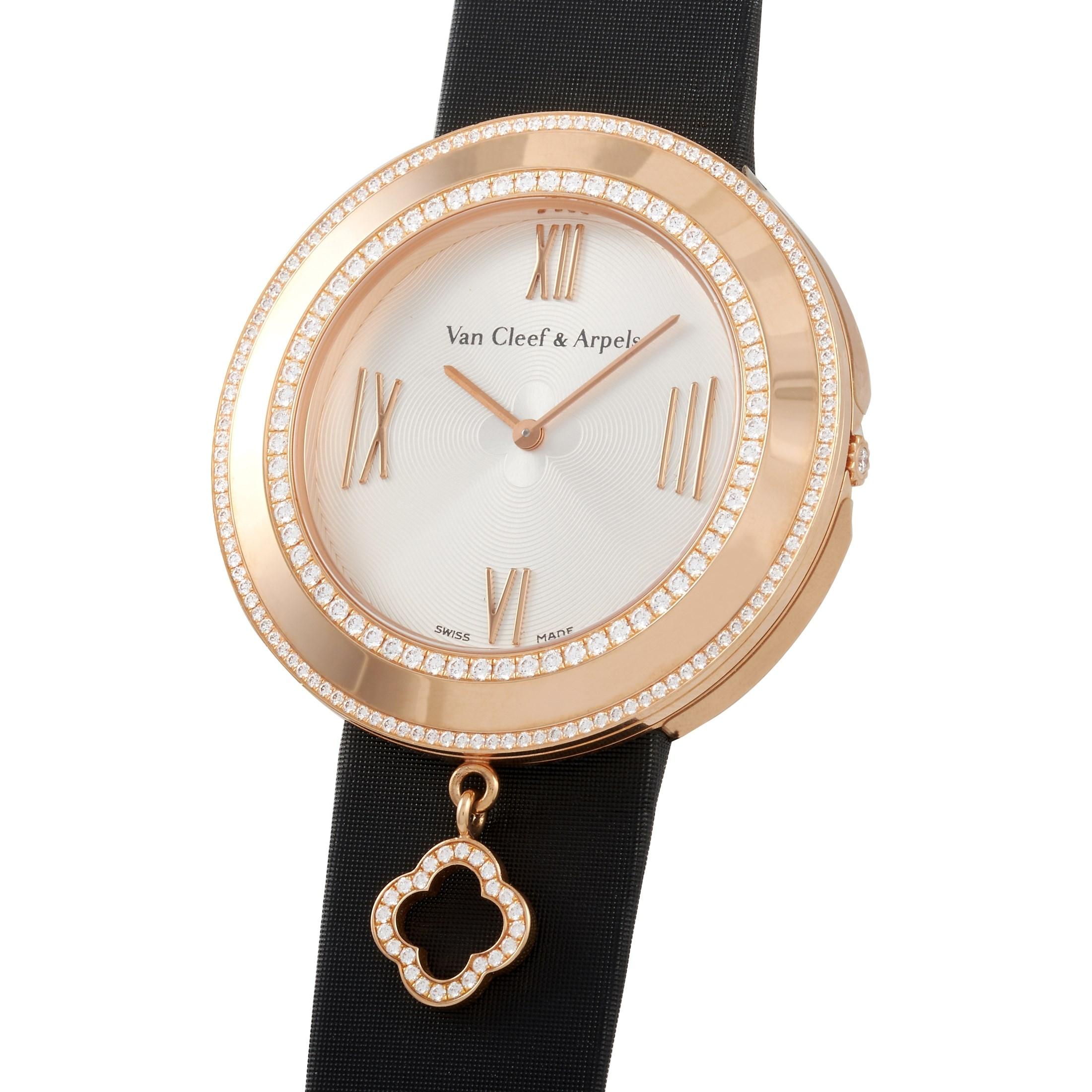 This Van Cleef & Arpels 18K Rose Gold Alhambra Charms Watch, reference number 2572198, features an 18K Rose Gold case measuring 38 mm in diameter. The bezel is set with two rows of round diamonds, and features an Alhambra charm. It is presented on a