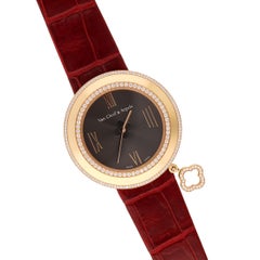 VAN CLEEF & ARPELS Montre à charms en or rose 18 carats avec diamants