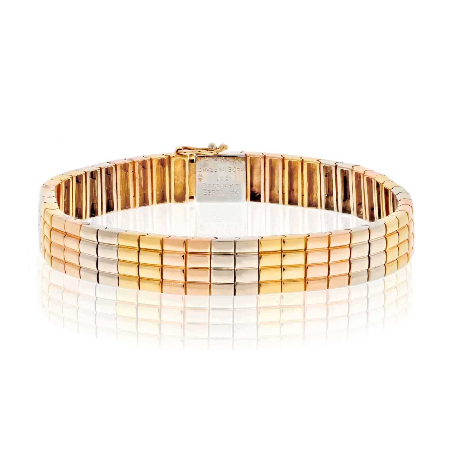 The vintage Van Cleef & Arpels Tri-Color Flat High Polish Bracelet is a true testament to the brand's exquisite craftsmanship and iconic design. This bracelet is a beautiful representation of Van Cleef & Arpels' signature tri-color gold technique,