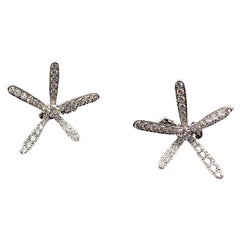 Van Cleef & Arpels Caresse d'Eole, orecchini a fiore con diamanti in oro bianco 18 carati