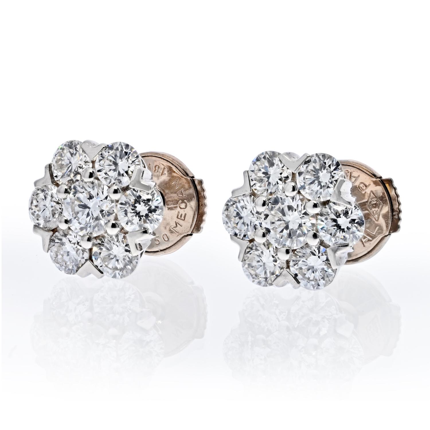 Van Cleef & Arpels 18K White Gold Fleurette Earstuds. 
18K White Gold. 
14 Round Diamonds 
Approx. 1.00cttw 
Width: 8mm 
Quality: DEF IF VVS
Studs with pushbacks. 