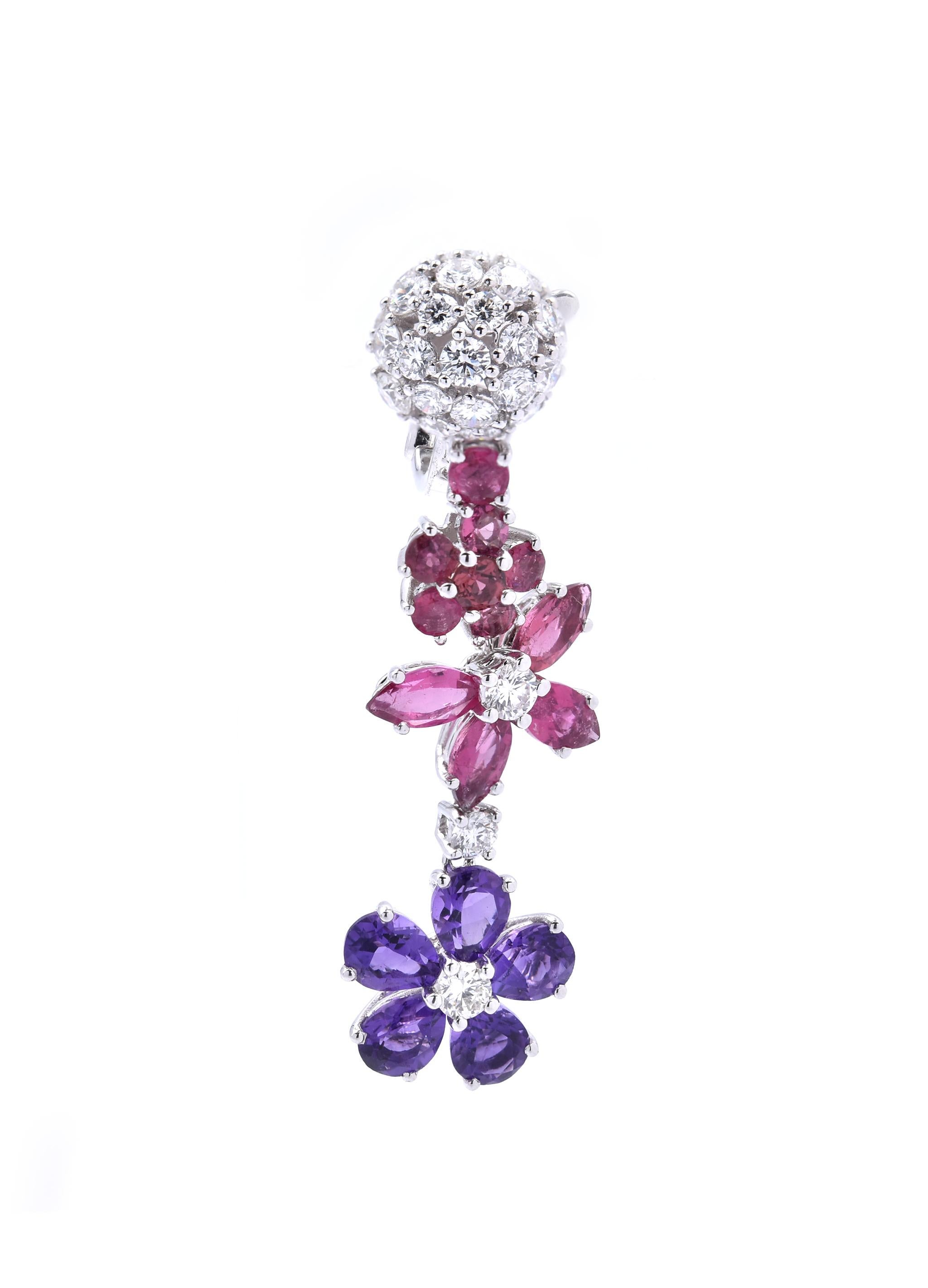 Designer: Van Cleef & Arpels
Material: 18k white gold
Sapphires: 28 mauve and pink sapphires = 6.27cttw
Diamonds: 64 round brilliant cuts = 3.16cttw
Color: G
Clarity: VS
Dimensions: earrings measure 41.80mm x 11.70mm
Fastenings: post with omega