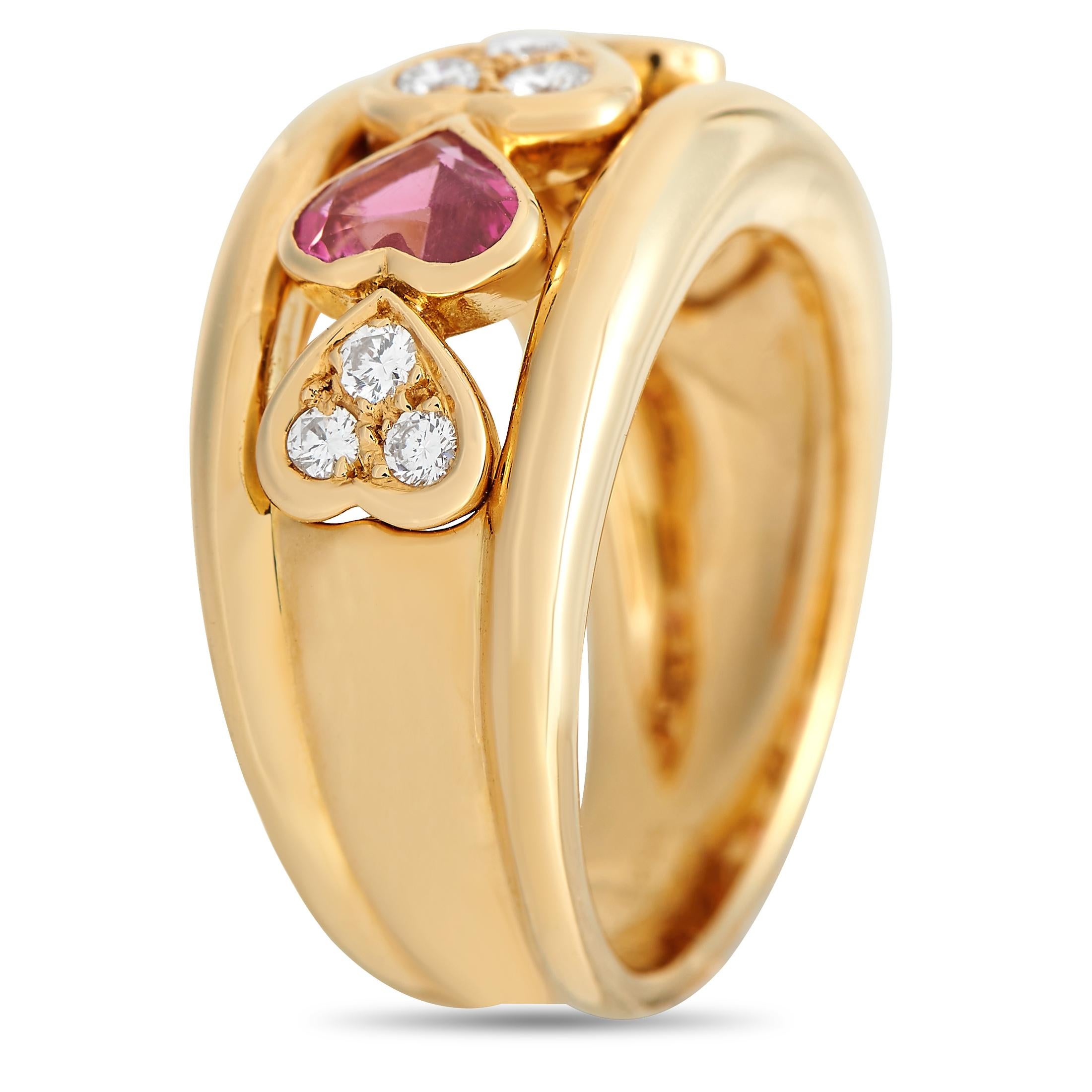A charming piece from Van Cleef & Arpels, this ring shimmers with sweet glitter from diamonds on heart bezels and faceted heart-shaped pink sapphires. The ring is made out of solid 18K yellow gold and has a split shank design. The gap holds a row of