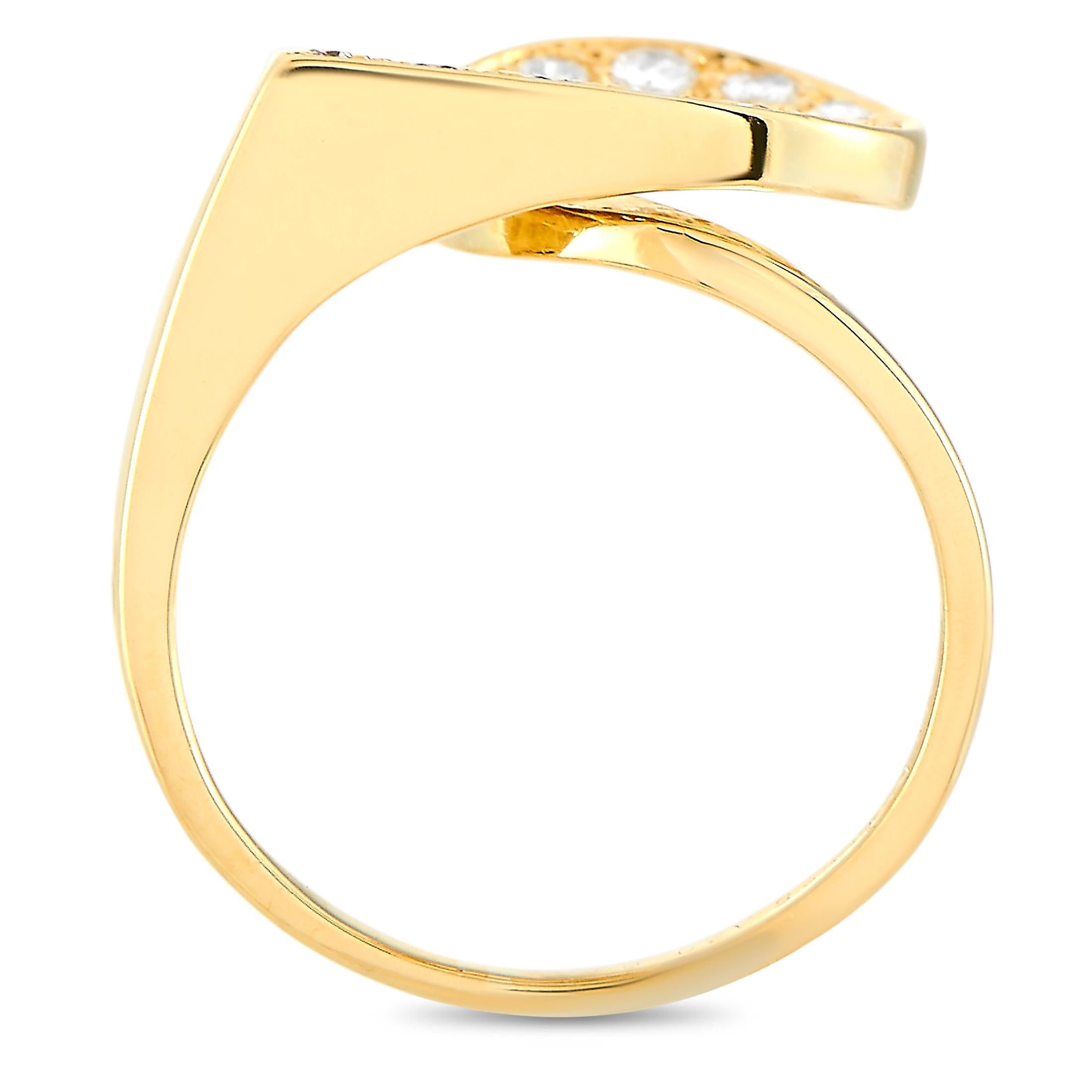 This Van Cleef & Arpels ring is made of 18K yellow gold and embellished with diamonds that amount to 0.30 carats. The ring weighs 4.2 grams and boasts band thickness of 2 mm and top height of 4 mm, while top dimensions measure 12 by 12 mm.
 
