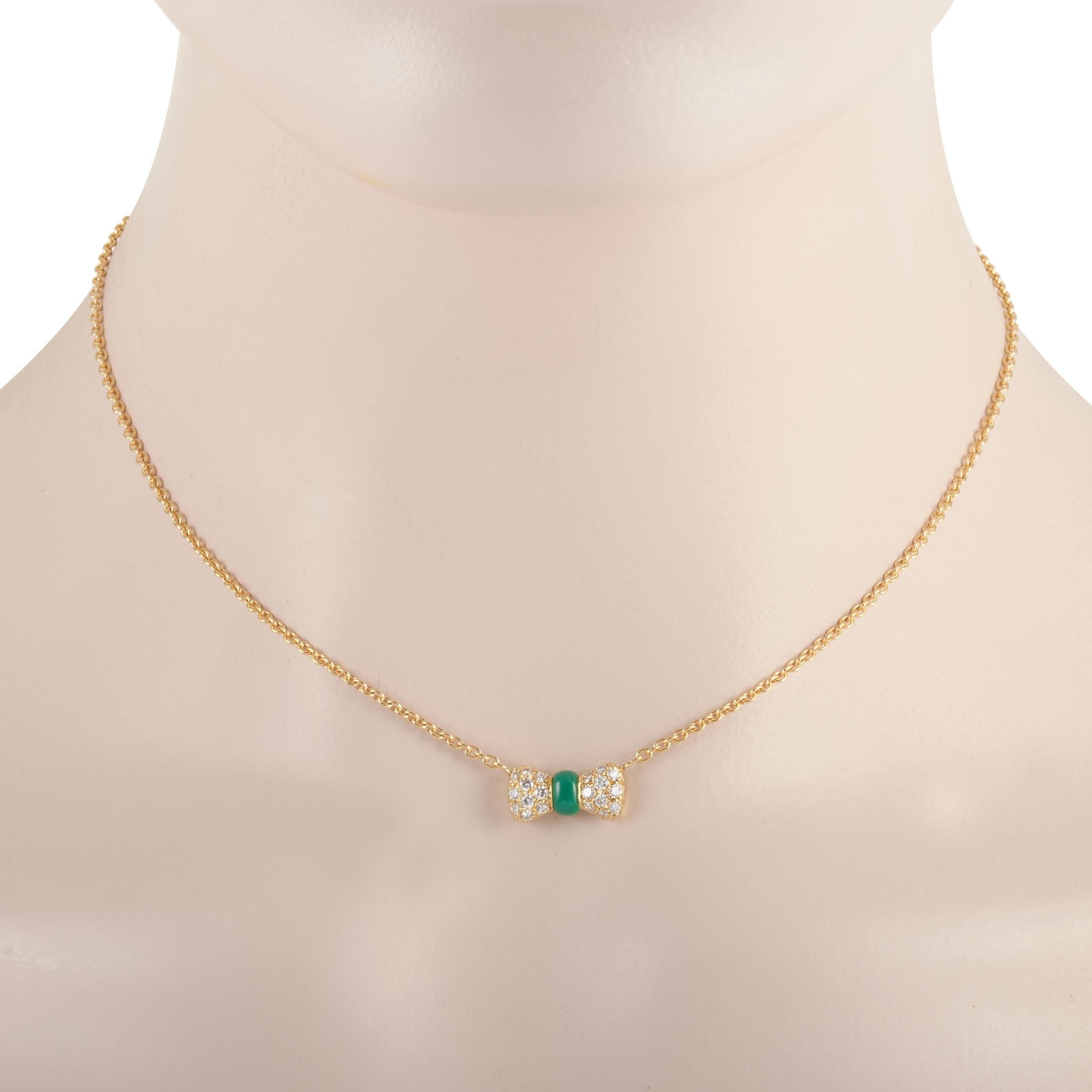 This Van Cleef & Arpels necklace is made of 18K yellow gold and embellished with a chrysoprase and a total of 0.39 carats of diamonds. The necklace weighs 5.5 grams and boasts a 14” chain and a pendant that measures 0.25” in length and 0.57” in
