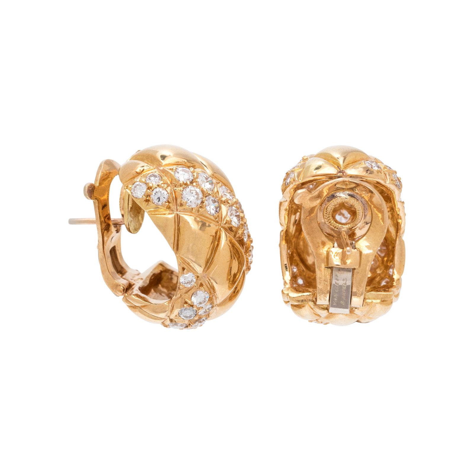 These Van Cleef & Arpel half hoop earrings feature a quilted pattern containing 62 round brilliant cut diamonds weighing approximately 1.85 carats set in 18K yellow gold. Posts with clip backs. 3/4 inch long. Signed Made in France Van Cleef & Arpels