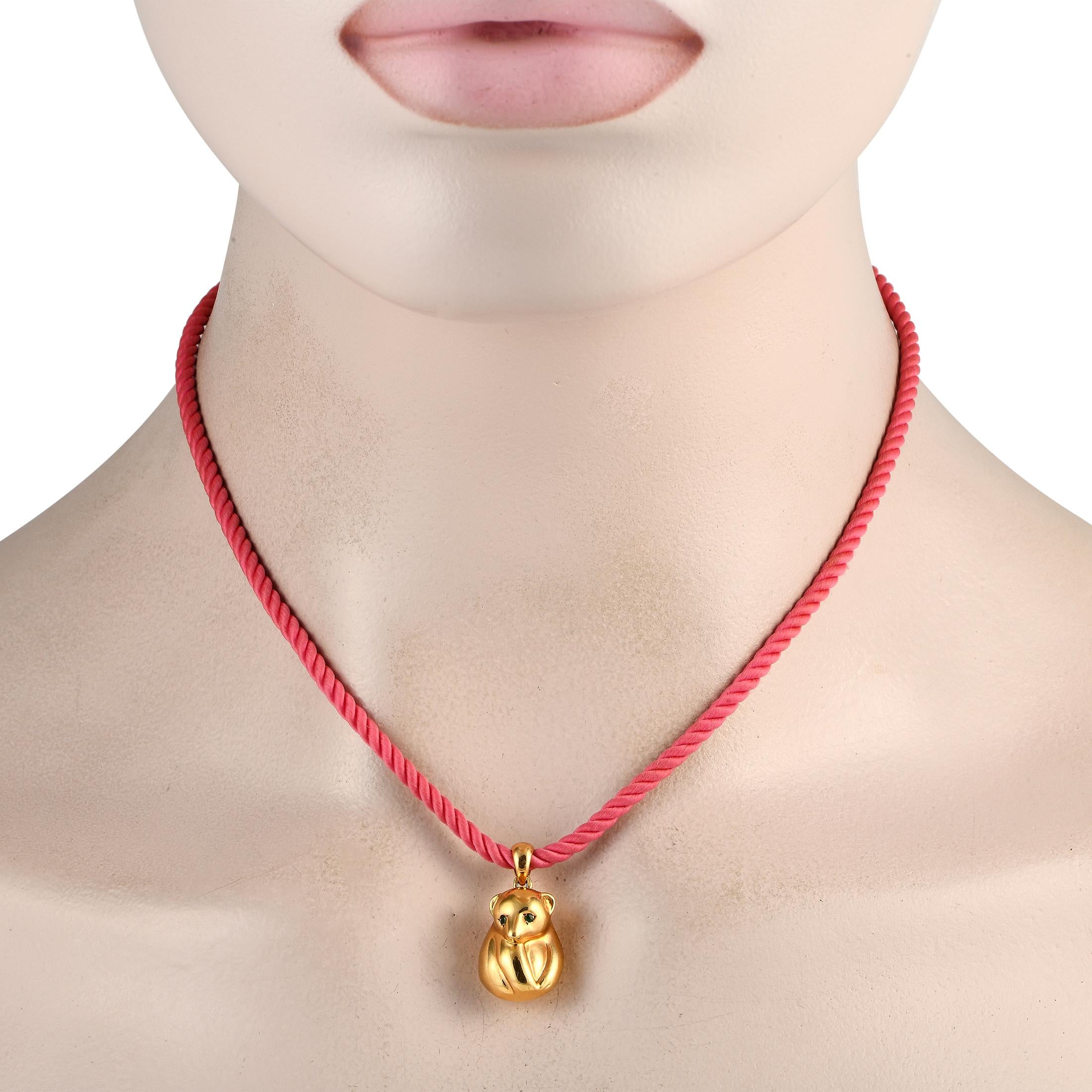 This Van Cleef & Arpels necklace possesses a unique sense of charm. Suspended from the vibrant 16” cord, you’ll find an 18K Yellow Gold bear-shaped pendant measuring 1.0” long by 0.50” wide. 
 
This jewelry piece is offered in estate condition and