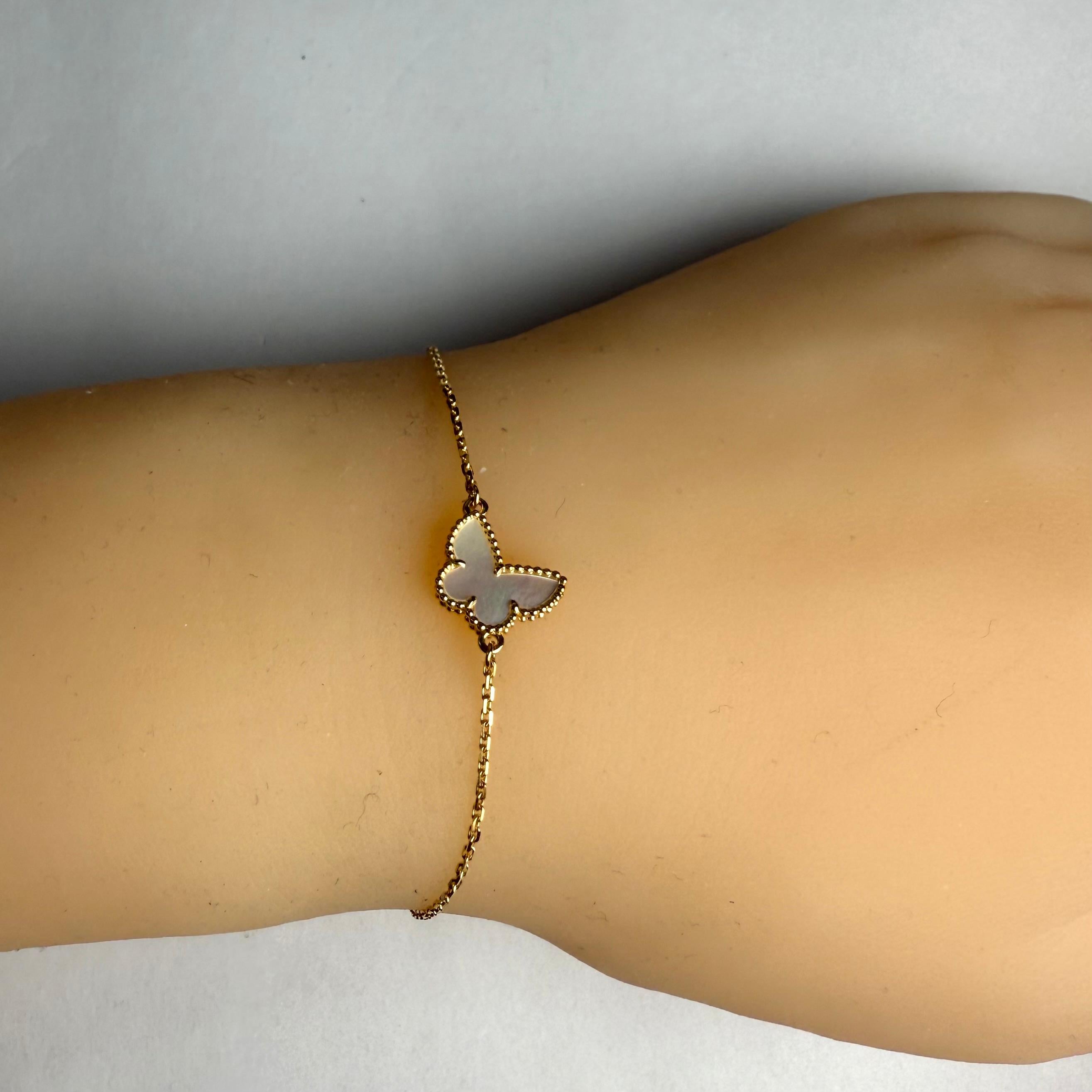 Van Cleef & Arpels 18K Yellow Gold Butterflies Mother-of-Pearl Bracelet Preowned In Good Condition For Sale In New York, NY