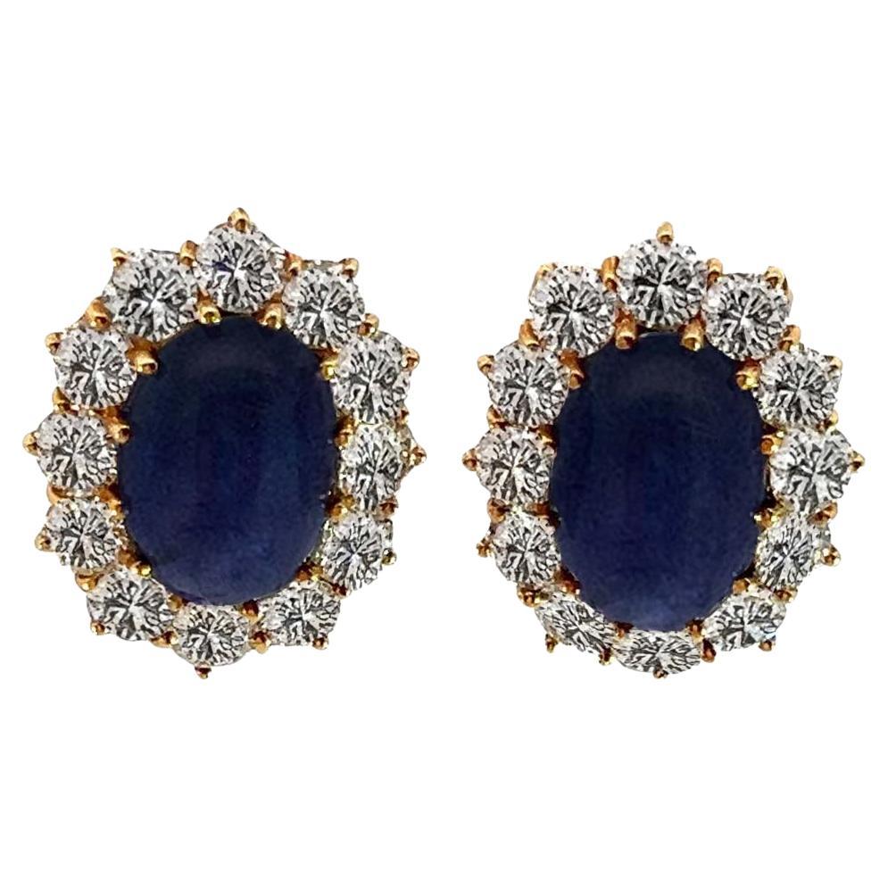 Oval Sapphire Cabochon and Diamond Earrings by Van Cleef and Arpels.
The center of these masterfully designed earrings features a pair of no-heat cabochon sapphires, each exuding a rich, velvety blue hue. The total carat weight of these no-heat oval