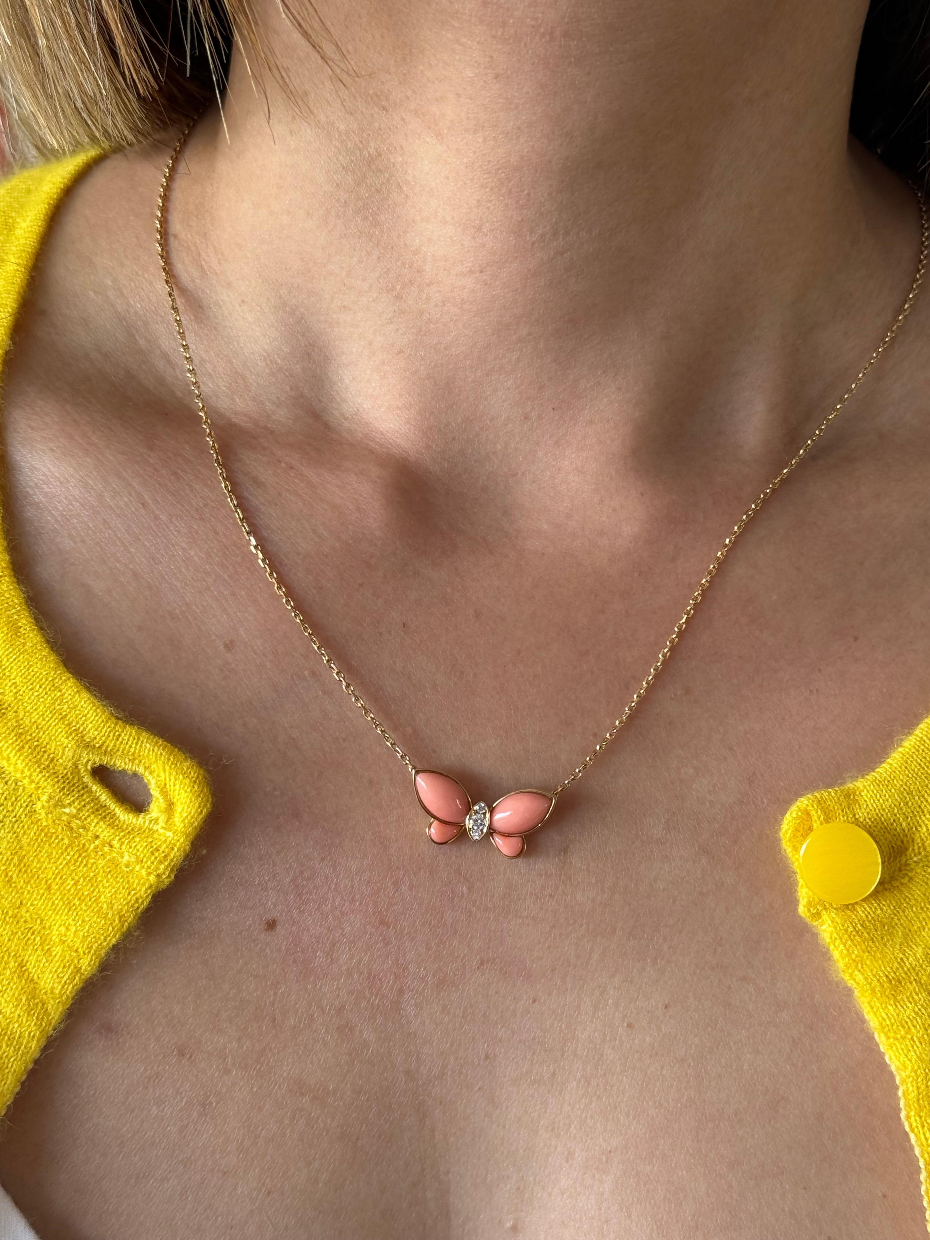 Beautiful Butterfly Coral Necklace by  Van Cleef & Arpels 18k yellow gold coral butterfly is accented by .07 cts brilliant cut diamonds. It is a vintage piece in excellent condition. Signed and hallmarked by the house of Van Cleef. 
Pendant
