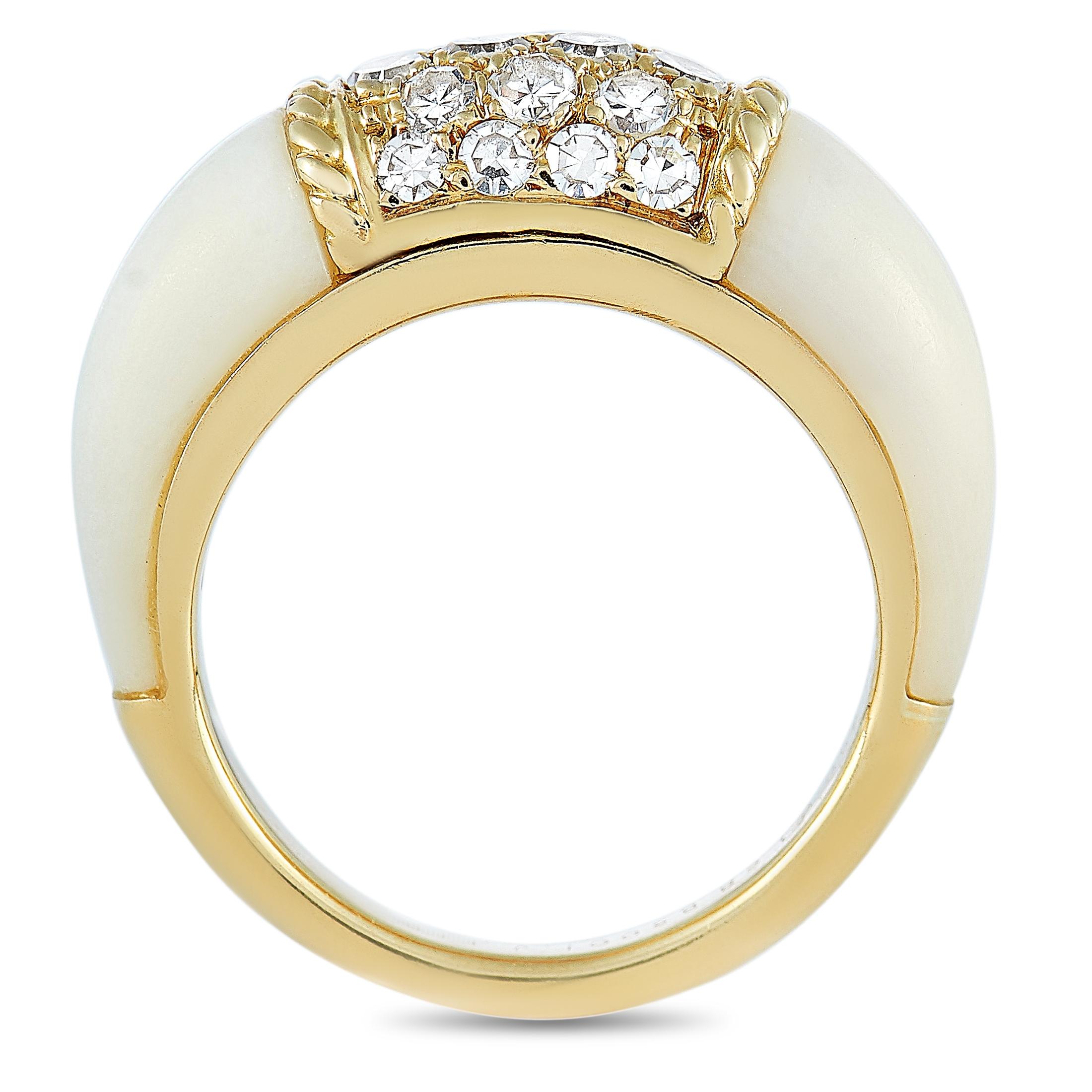 This Van Cleef & Arpels ring is made of 18K yellow gold and embellished with diamonds and white coral. The ring weighs 6.5 grams and boasts band thickness of 2 mm and top height of 6 mm, while top dimensions measure 12 by 6 mm.
 
 Offered in estate