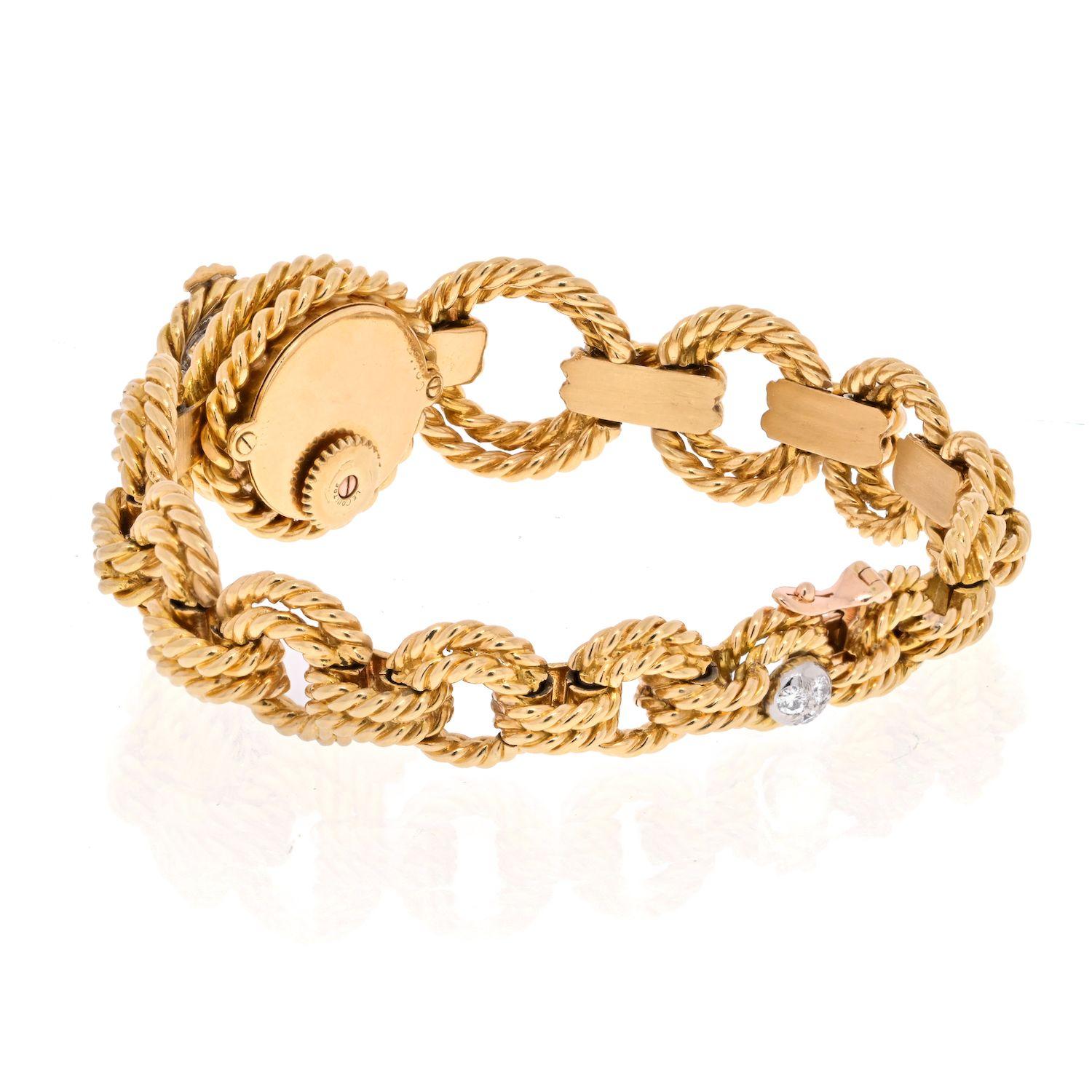 Very special item designed by Van Cleef & Arpels, this is a ropetwist gold and diamond open link bracelet watch. Designed with graduating twist rope segments whith the center section flipping open to reveal the hidden timepiece. 
Made in 18K and