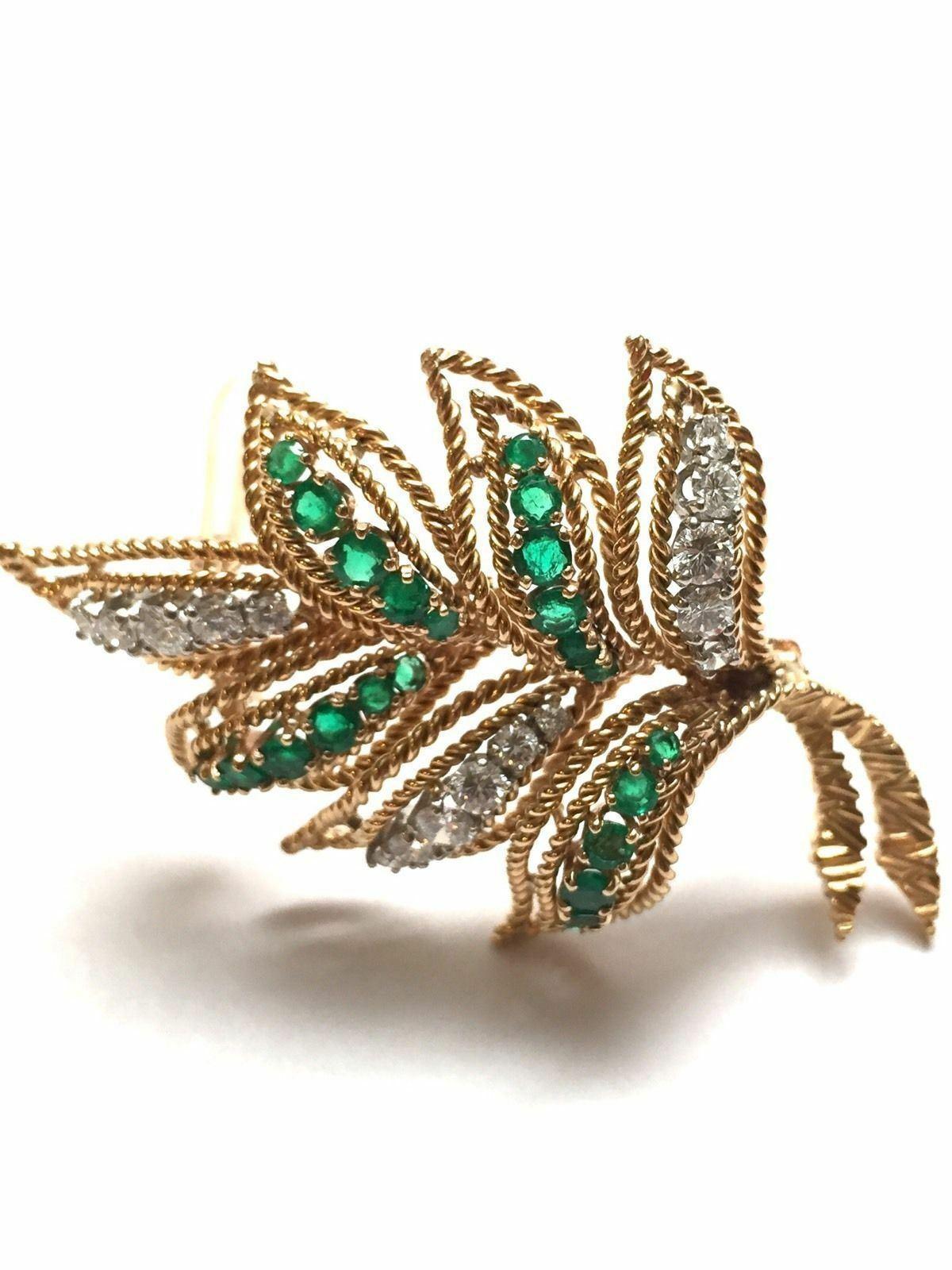 Van Cleef & Arpels 18K Yellow Gold Diamond Emerald Leaf Brooch Pin

This gorgeous vintage brooch dates back to the 1960's.

It is created with braided leaves of gold set with genuine green emeralds and diamonds.

16 round brilliant diamonds graded