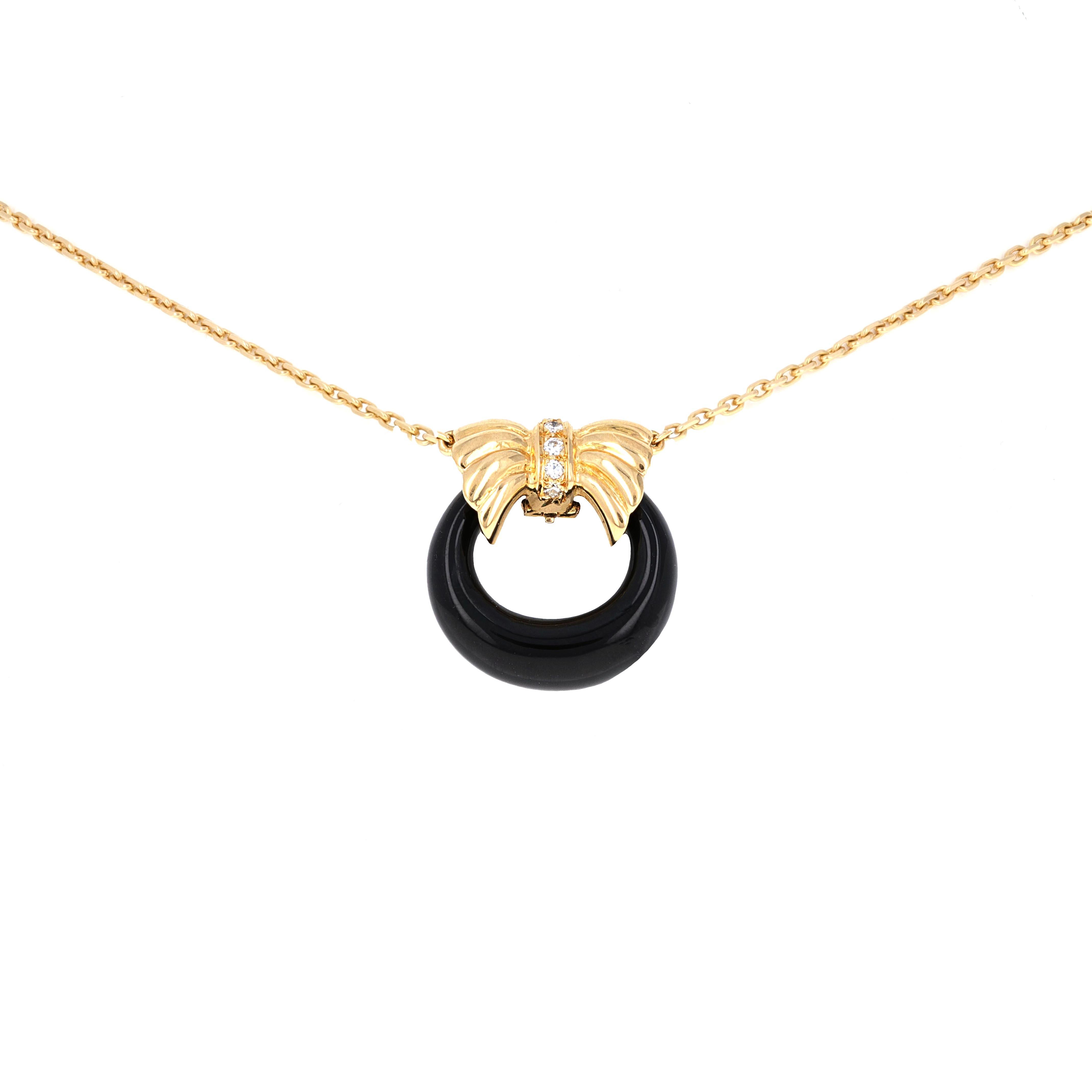 18k Yellow Gold Diamond Interchangable Pendant Necklace by Van Cleef & Arpels . This necklace comes with 3 interchangeable pendants. The pendants are Chalcedony, Black Onyx and Jade. The pendant closure has 5 round brilliant diamonds weighing an