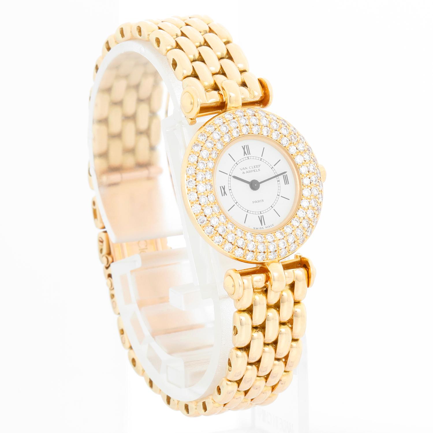 Van Cleef & Arpels 18K Yellow Gold Diamond Watch - Quartz. 18K Yellow Gold  with three row diamond bezel ( 24 mm ). Off white dial with black  Roman numeral. 18K Yellow gold van cleef & arpels bracelet with deployant clasp; will fit up to a 6 1/4