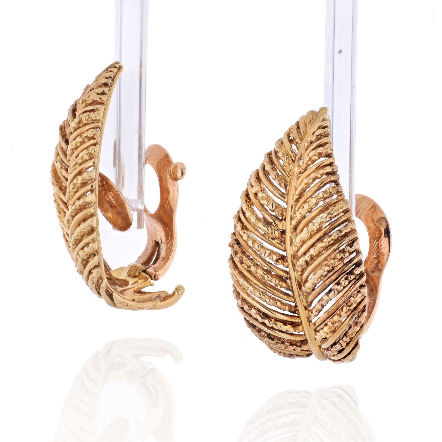 A beautiful pair of VCA diamond and 18K gold earrings with a lovely leaf motif.
Organic patter of leaves with a secure clip on backing. 
Earrings measure 33mm and have a very romantic vintage flare. 