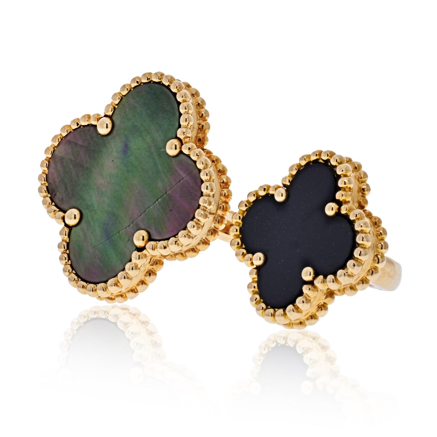 Van Cleef & Arpels 18K Yellow Gold Grey Mother of Pearl and Black Onyx Magic Alhambra Between the Finger Ring. Size 50 US 5.25.  This stunning open Alhambra ring is crafted of 18k yellow gold and features two clover motifs one 20mm set in grey