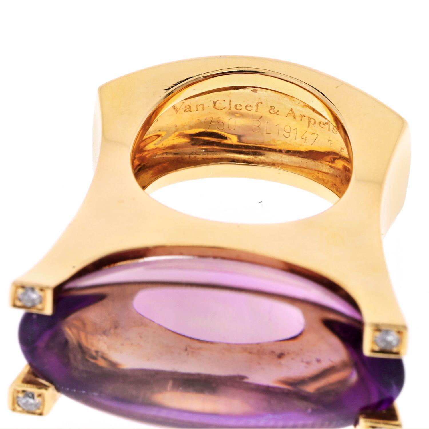We are delighted to have this model back in stock: Van Cleef and Arpels cocktail ring featuring a vivid amethyst encased by 4 of the finest Van Cleef and Arpels round brilliant cut diamonds in 18k yellow gold. 4 round brilliant cut diamonds of VVS1