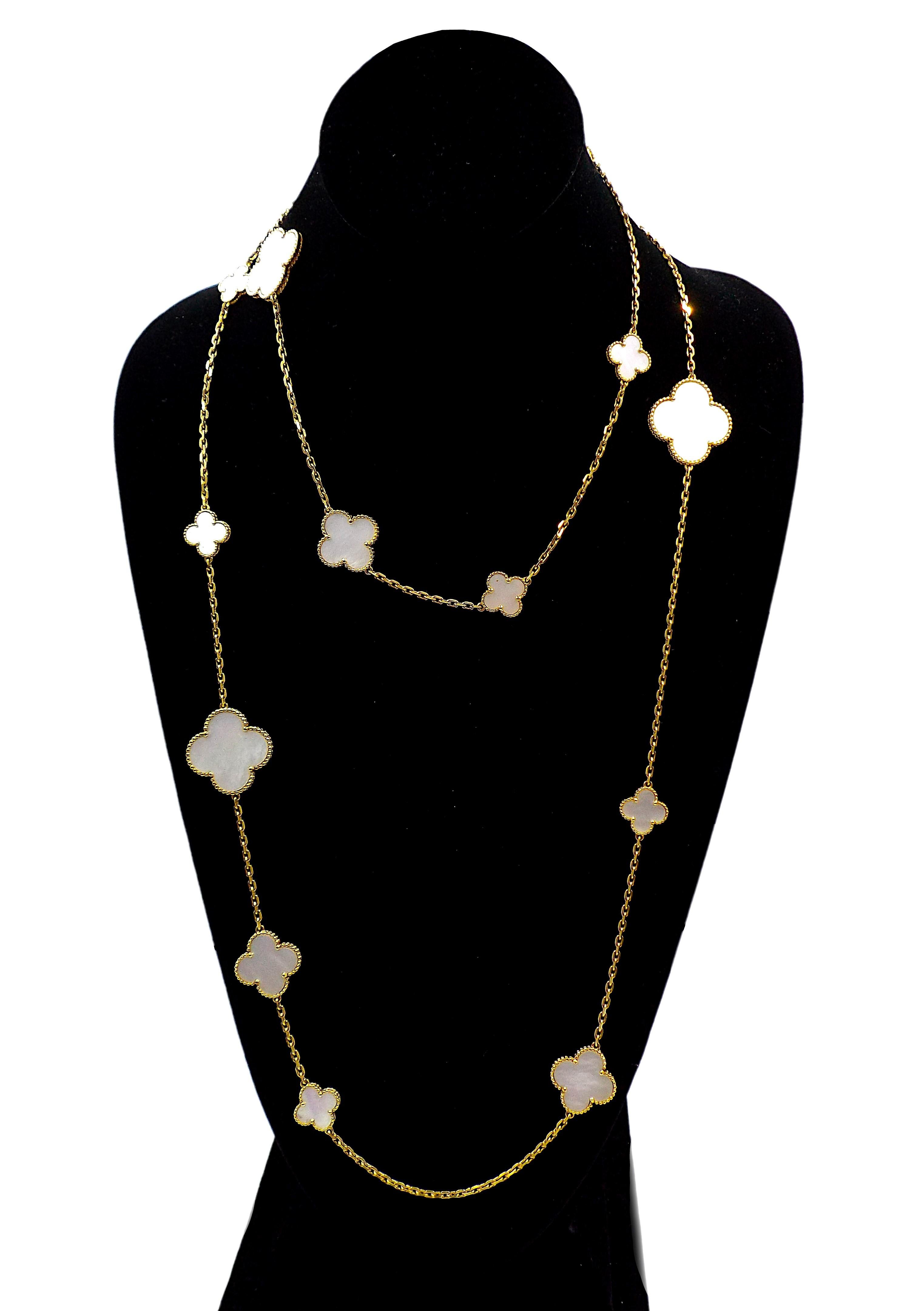 Magic Alhambra long necklace, 16 motifs, 18K yellow gold, white mother-of-pearl. Chain length is 120 cm. Signed, numbered, stamped 750.