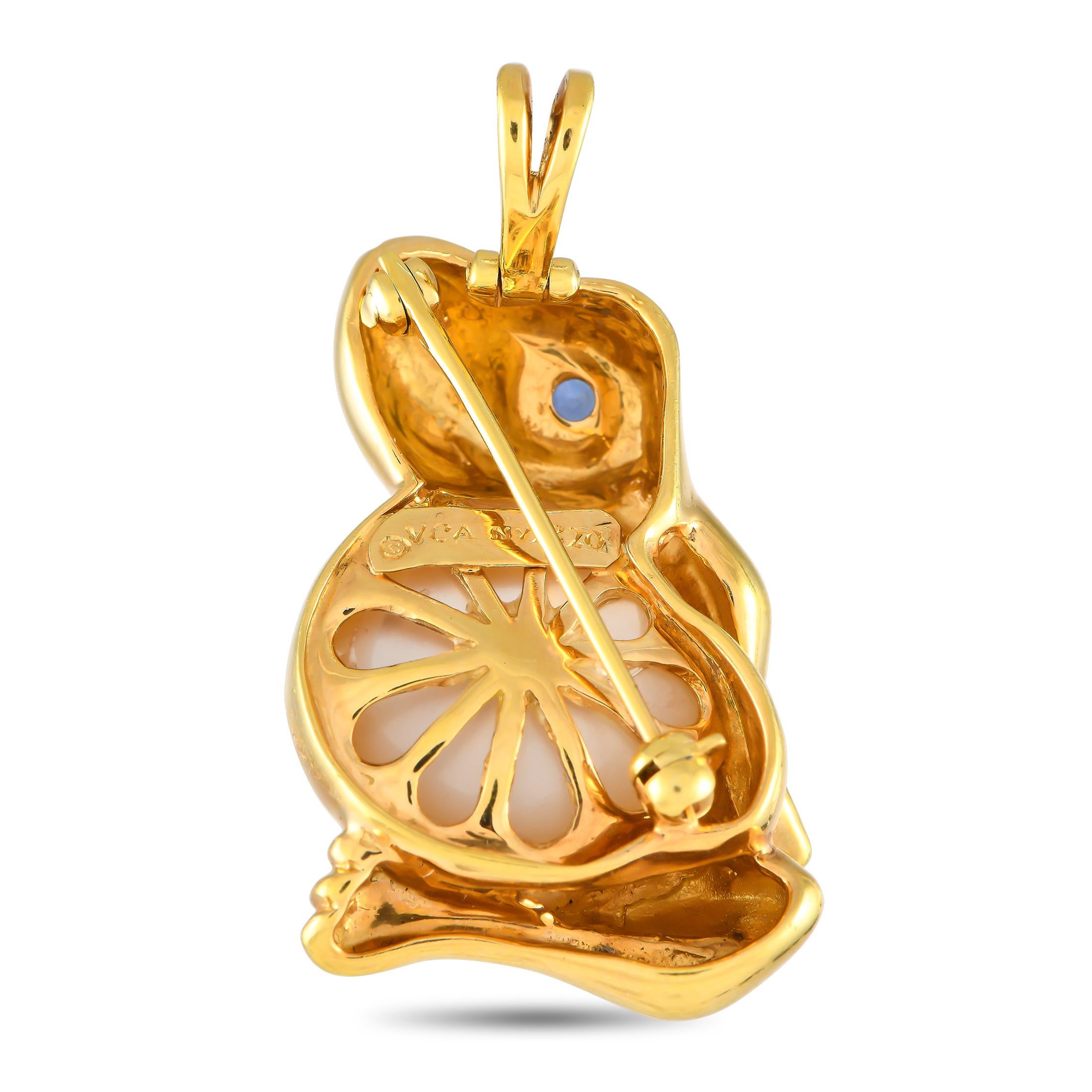 A pin and pendant in one, this Van Cleef & Arpels creation would make a fine choice to reinvent your style with playful accessorizing. This 18K yellow gold piece of jewelry features a frog silhouette with a sapphire eye and a gorgeous Mother of