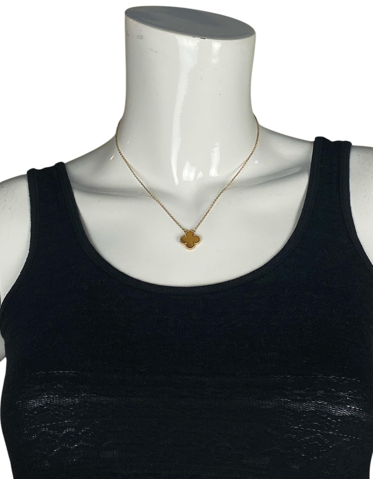 Van Cleef & Arpels 18K Yellow Gold/ Tiger Eye Vintage Alhambra Necklace

Made In: France
Materials: Tiger eye, 18k yellow gold
Hallmarks: VCA Au750, serial number
Closure/Opening: Lobster clasp
Overall Condition: Excellent
Estimated Retail: $3,300
