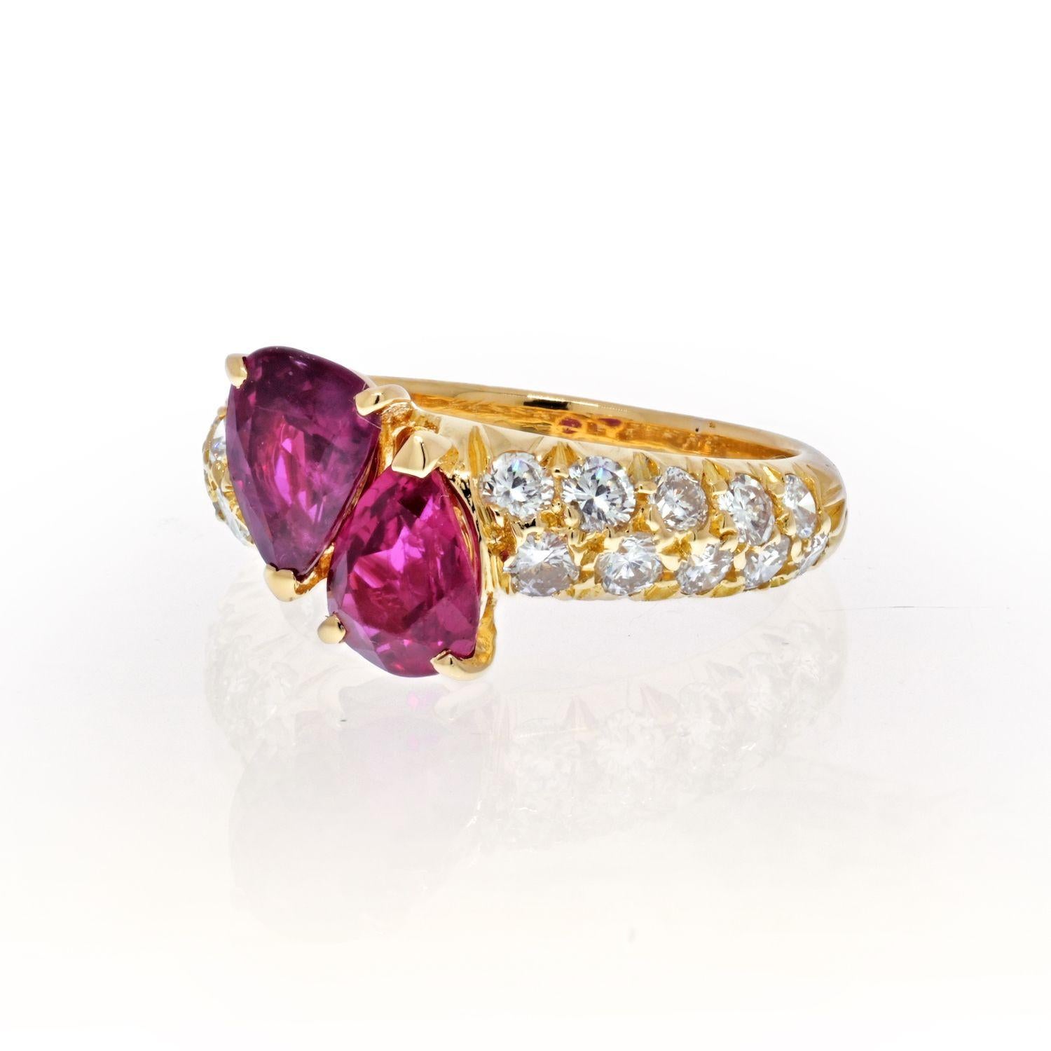 Vintage Van Cleef and Arpels 18K yellow gold cross-over or toi et moi ring consisting of 2 pear shaped rubies weighing 3.00 carats in total. Can serve as a lovely promise or an engagement ring. 
This style of ring has been popular as an engagement