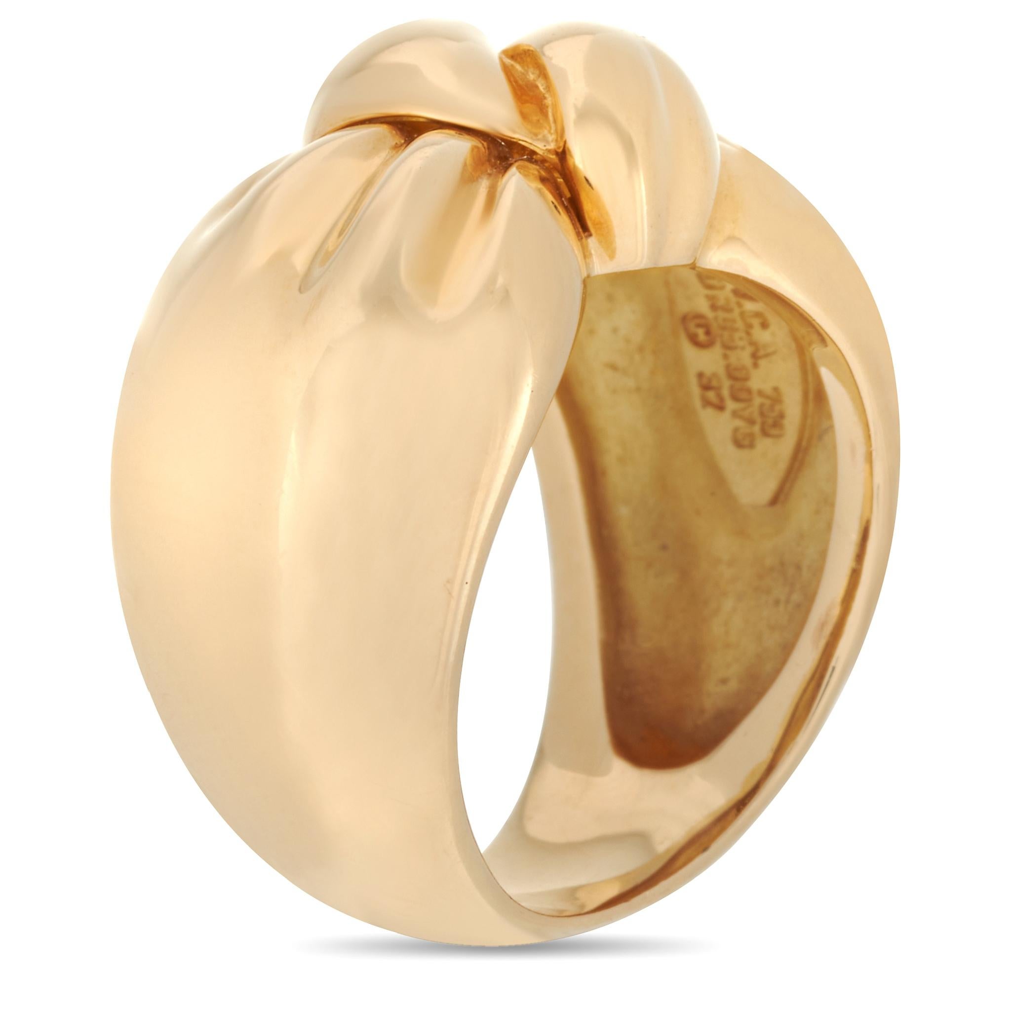 This Van Cleef & Arpels turban ring is crafted from 18K yellow gold and weighs 13.2 grams. It boasts band thickness of 8 mm and top height of 6 mm, while top dimensions measure 10 by 20 mm.
 
 The ring is offered in estate condition and includes the